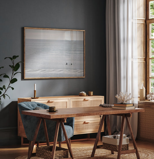 Horizontal minimalist ocean art with a close-up blue waves print of water, featuring subtle ripples and soft textures, ideal as a neutral ocean print, two surfers sit and watch the waves. Photograph in minimalist mock up.