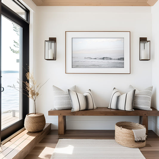 Horizontal minimalist ocean art with a close-up blue waves print of water, featuring subtle ripples and soft textures, ideal as a neutral ocean print, surfers in the waves. Photograph in minimalist mock up.