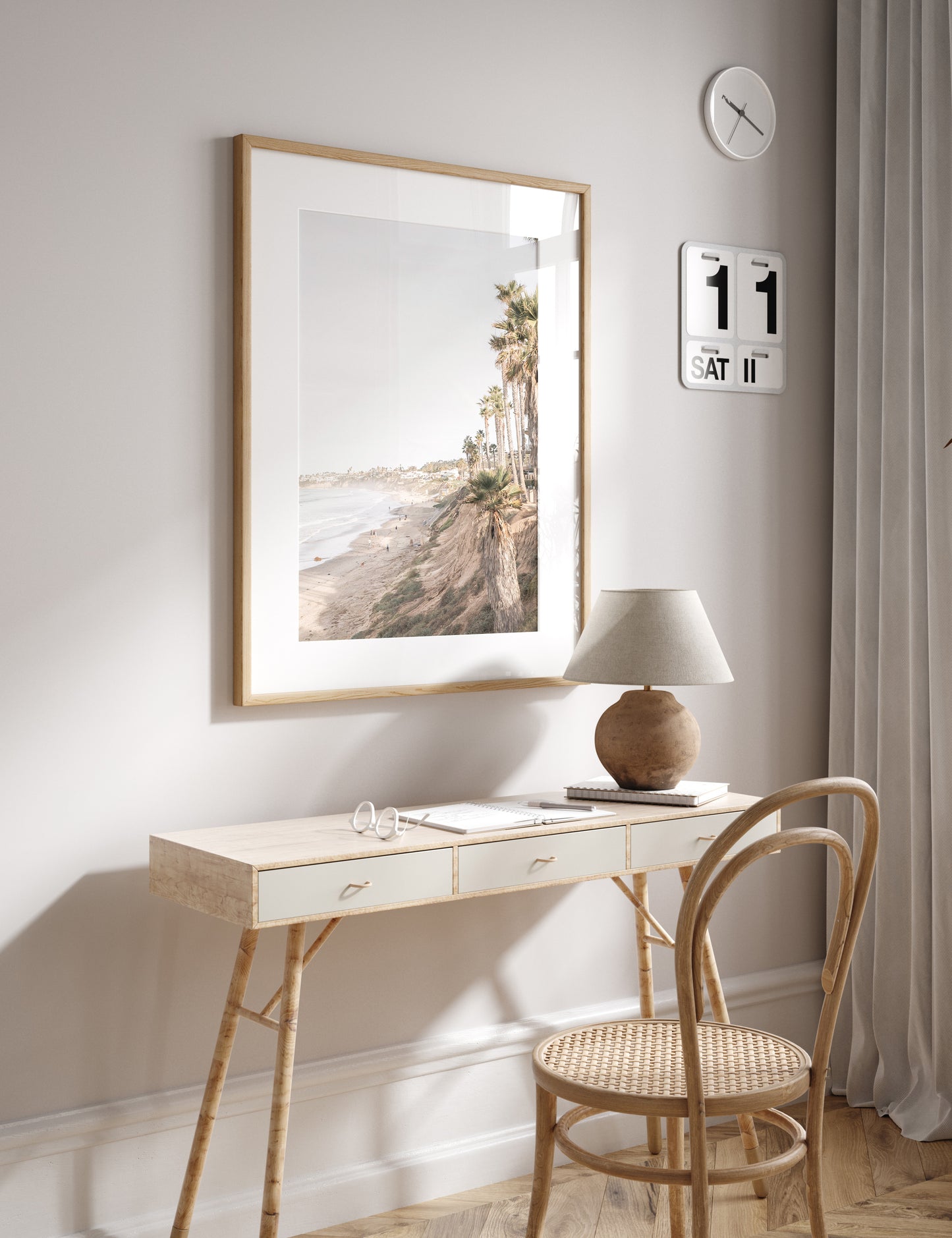 Vertical California coast print featuring a high vantage point overlooking Pacific Beach, with tall palm trees, a sandy beach, and the ocean. This coastal print offers a beautiful seascape. Photograph in minimalist mock up.