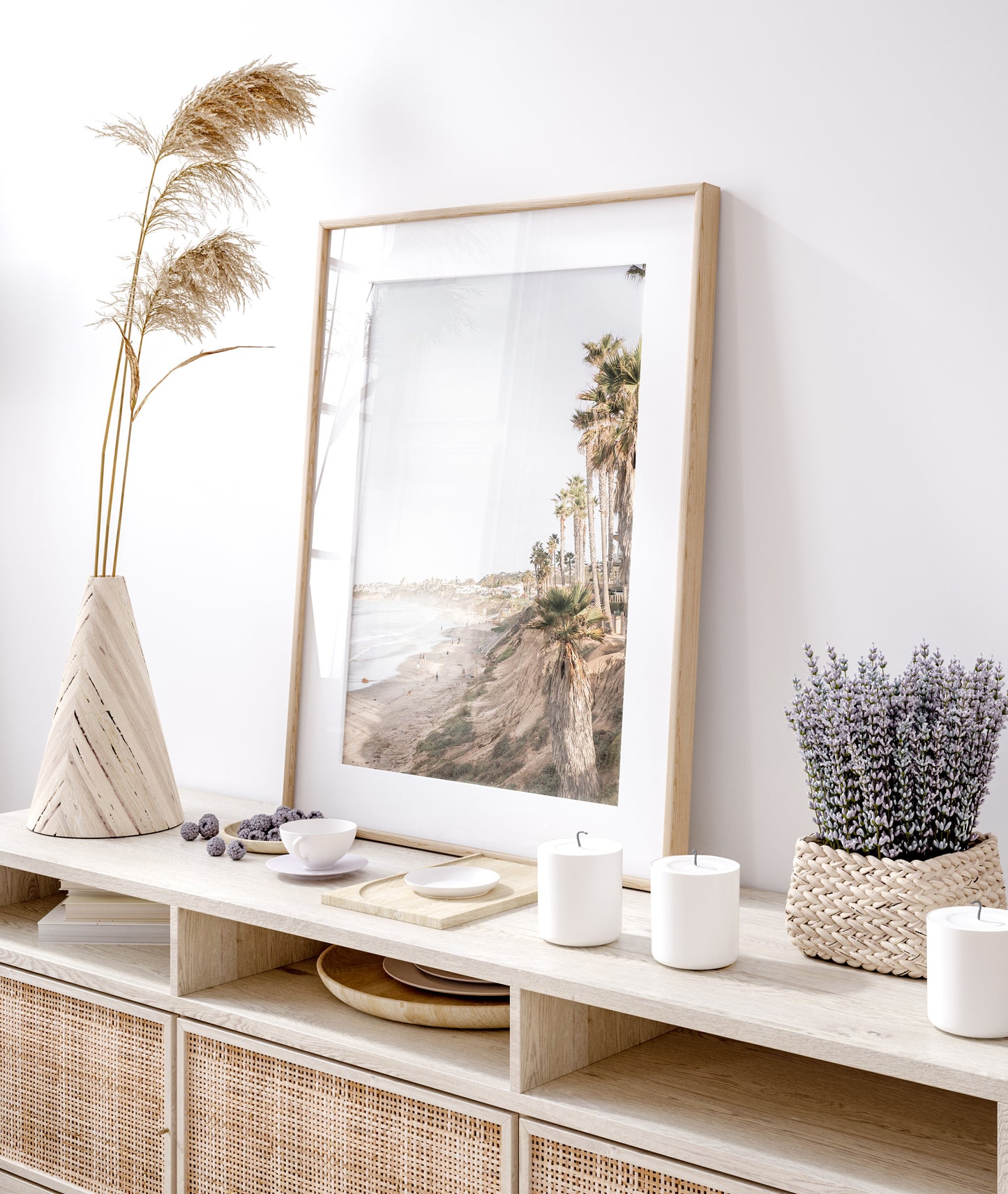 Vertical California coast print featuring a high vantage point overlooking Pacific Beach, with tall palm trees, a sandy beach, and the ocean. This coastal print offers a beautiful seascape. Photograph in minimalist mock up.