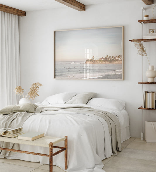 Landscape San Diego beach print of Tourmaline Beach, Pacific Beach, San Diego, showing a large group of surfers in the water near a residential cliff. This surf vibes print captures the local surf scene. Photograph in minimalist mock up.