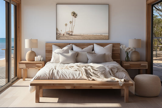 Landscape beach photography of Venice Beach, California, showcasing the sandy beach, ocean, and a small shelter with palm trees along the boardwalk. Captures the casual beach art feel. Photograph in minimalist mock up.