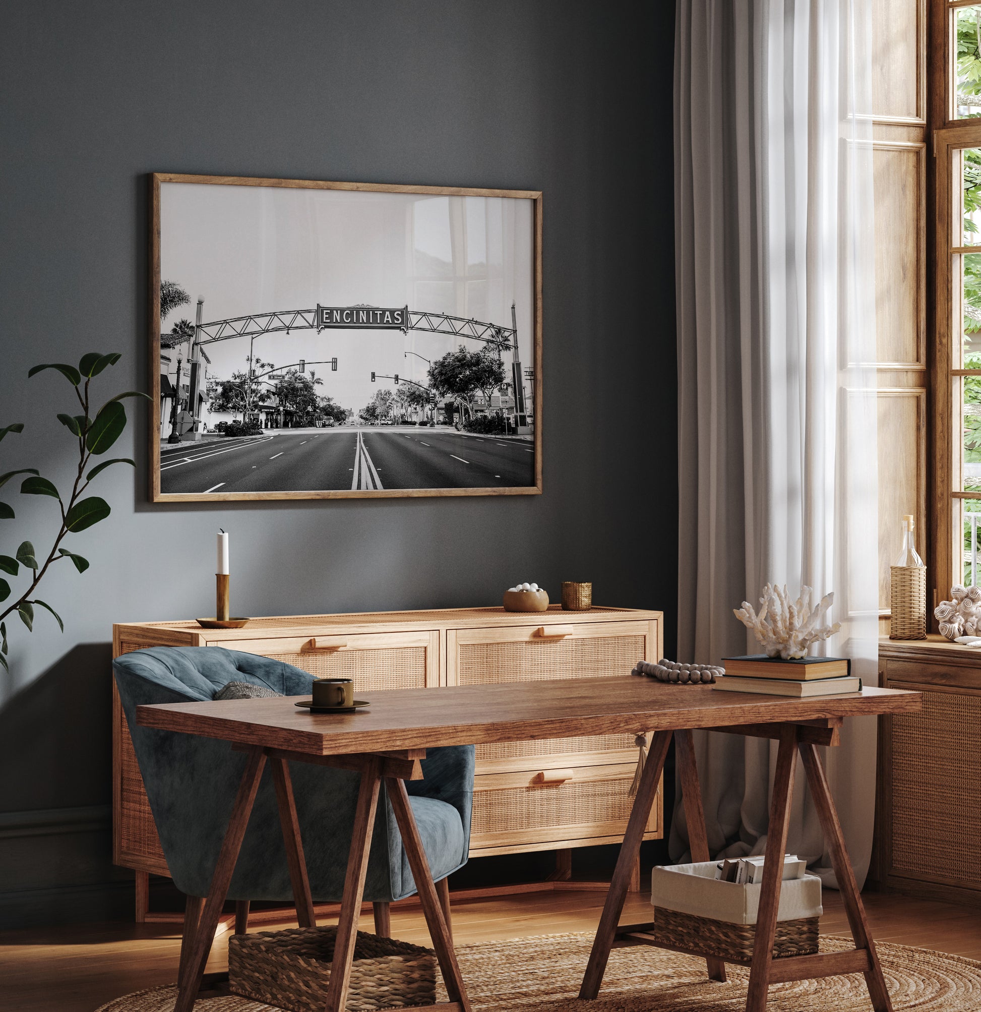 A black and white photograph of a street sign that reads 'Encinitas' with a background of a city street. Photograph in minimalist mock up.