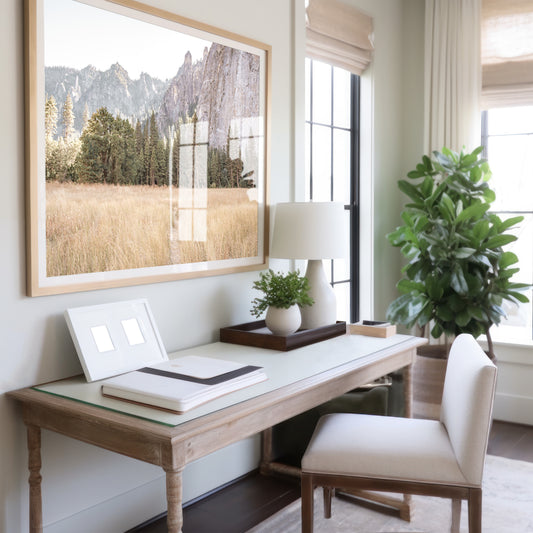 Fine art Yosemite Valley horizontal  landscape print by Southern California photographer Kim Dybczak of Salt Creek Prints, featuring a golden field and granite cliffs with with a valley in the mountains distance. Photograph in office mock up