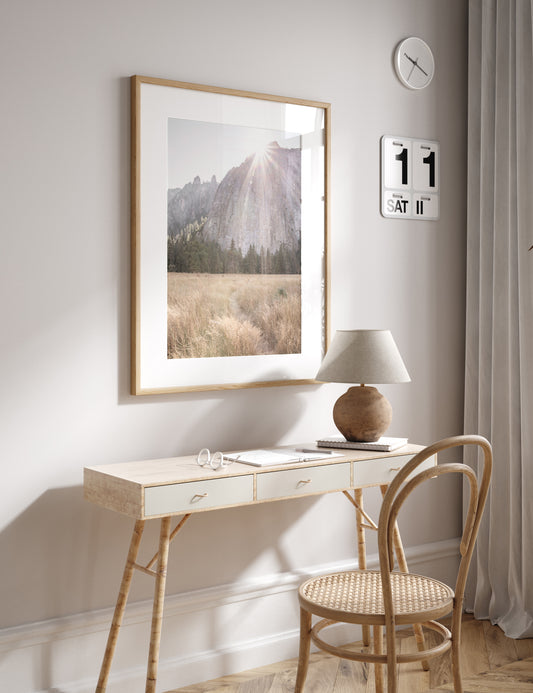 Fine art Yosemite Valley landscape print by Southern California photographer Kim Dybczak of Salt Creek Prints, featuring a golden field and granite cliffs with sunlight streaming over the mountains. Photograph in minimalist mock up