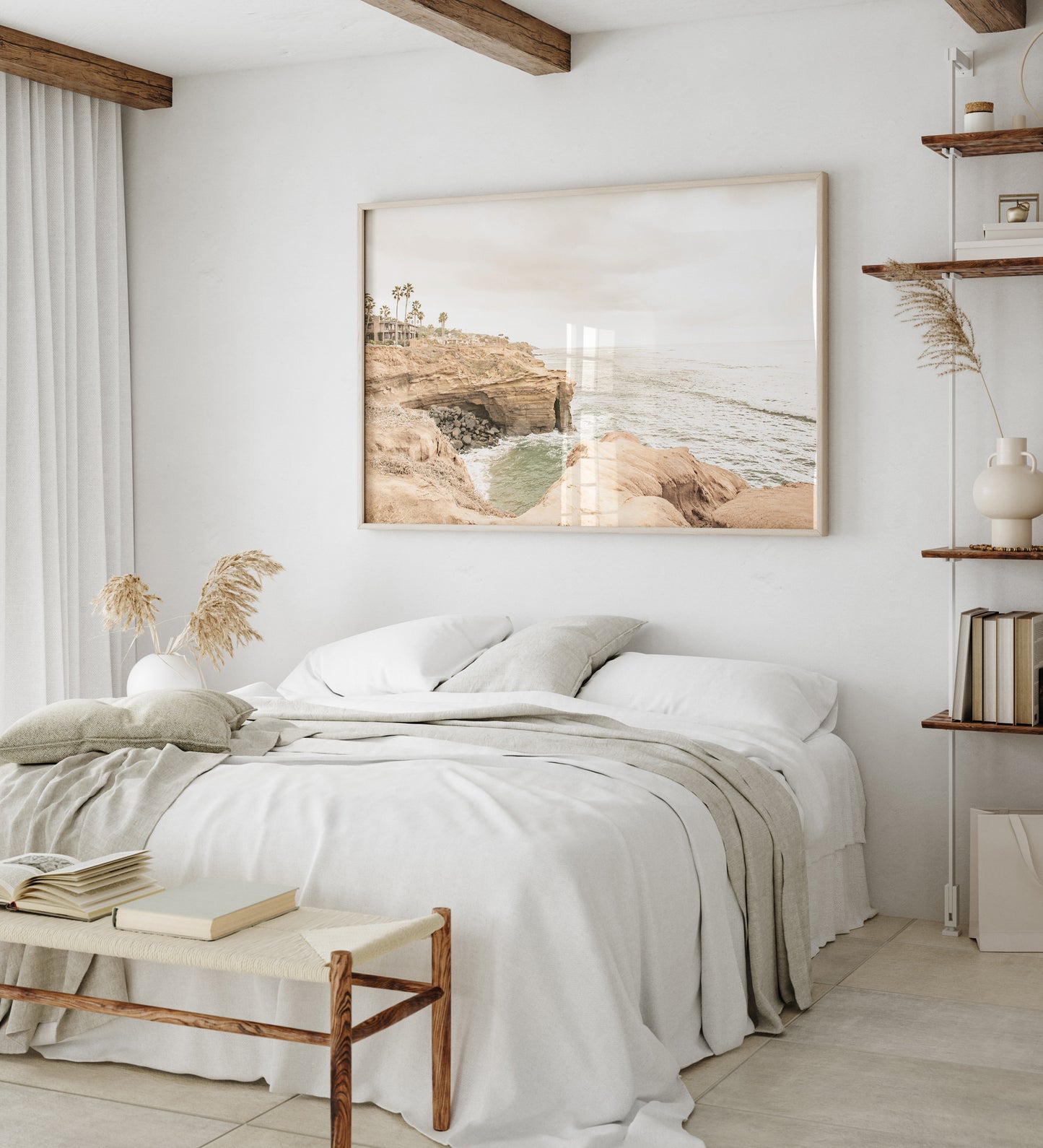 Fine art of Sunset Cliffs, San Diego California horizontal print of hazy high-angle landscape beach photography captures a light blue ocean meeting tall tan, rocky, brown cliffs rise as iconic coastal scenery. Photograph in minimalist mock up.