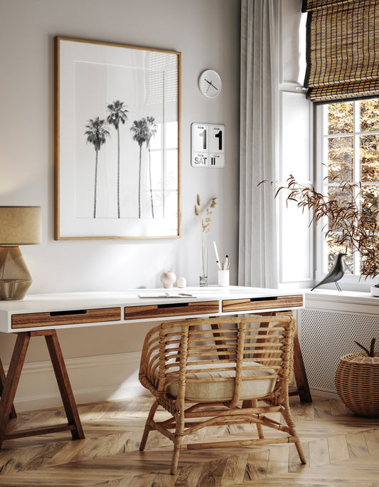 Minimalist palm tree print in black and white, showcasing a line of tall palm trees against a bright background. This vertical wall art is a coastal palm tree print. Photograph in minimalist mock up.