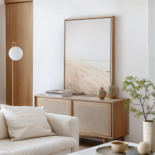 Framed fine art photograph of beige sand and white waves at Solana Beach hung on a wall