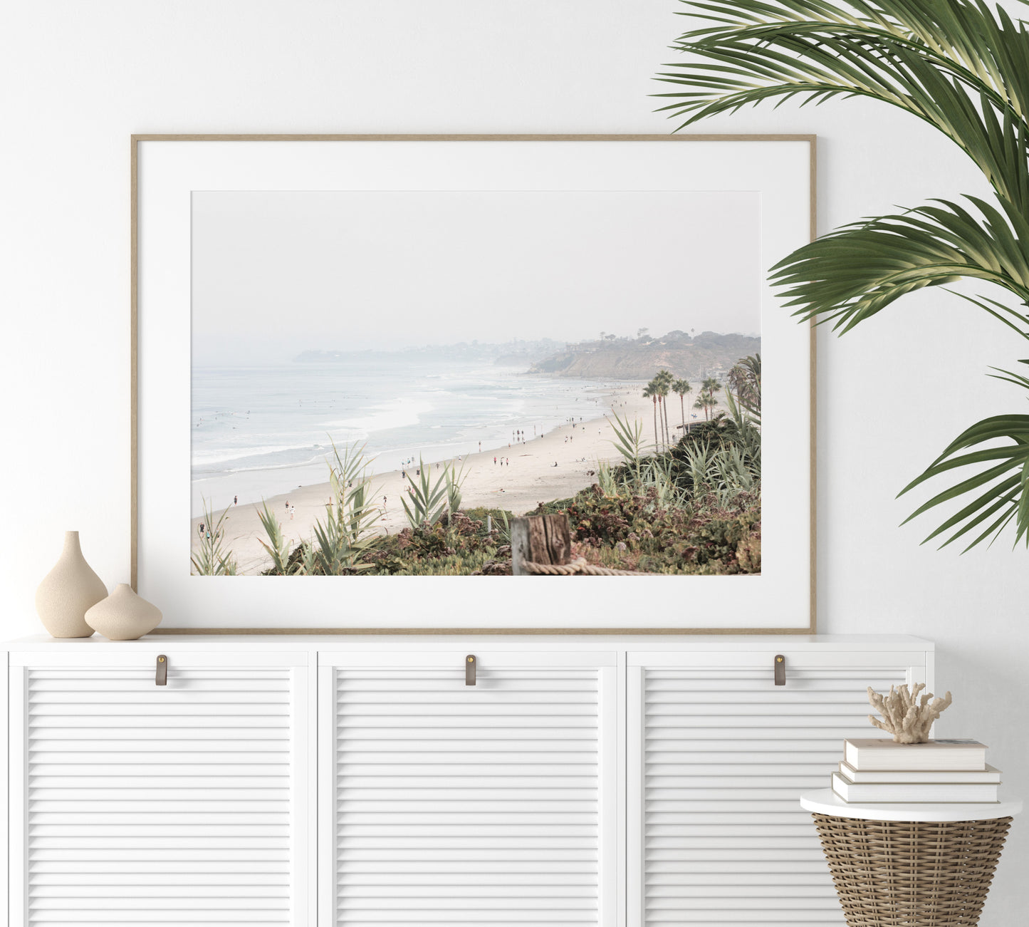 Landscape San Diego beach print showing seascape with gentle ocean waves in the water near a sandy cliff. Photograph in minimalist mock up.