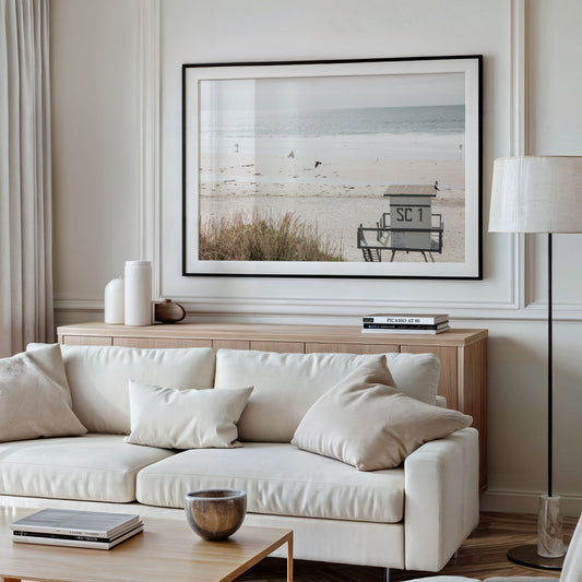Landscape coastal photography of Salt Creek Beach Park featuring a lifeguard tower (SC 1) on the sand, with distant figures and ocean waves. This beachscape print has a calming vibe. Photograph in minimalist mock up.