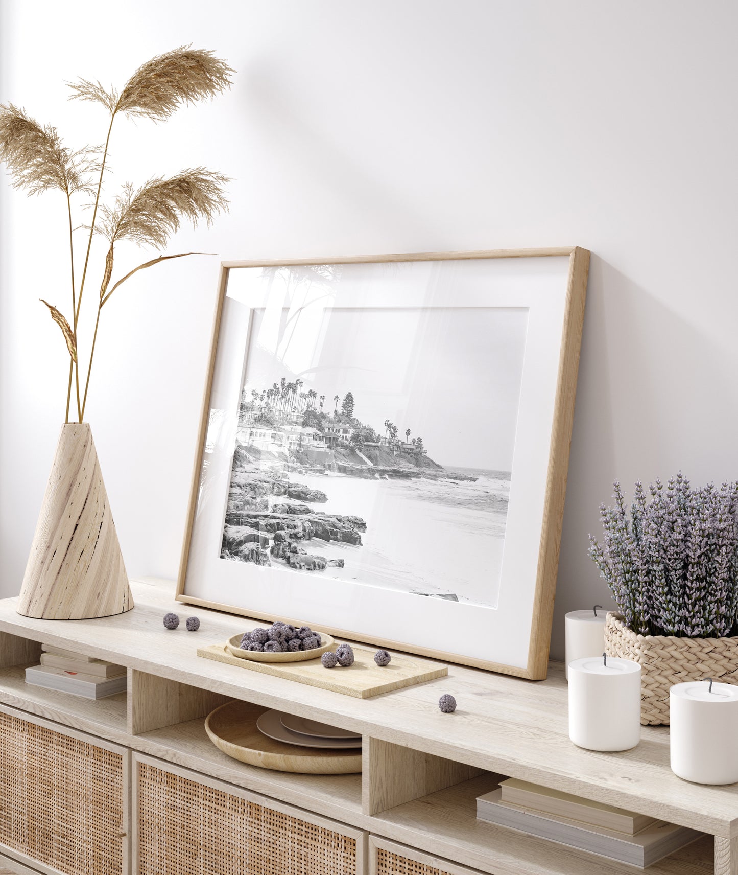 Fine art of WindanSea Beach, La Jolla California horizontal landscape black and white print by Southern California photographer Kim Dybczak of Salt Creek Prints, featuring a powerful waves crashing against the rocky shore of California coast. Beach homes and palm trees sit atop the cliffside, with stairs leading down to a sheltered area. Photograph in minimalist framed mock up