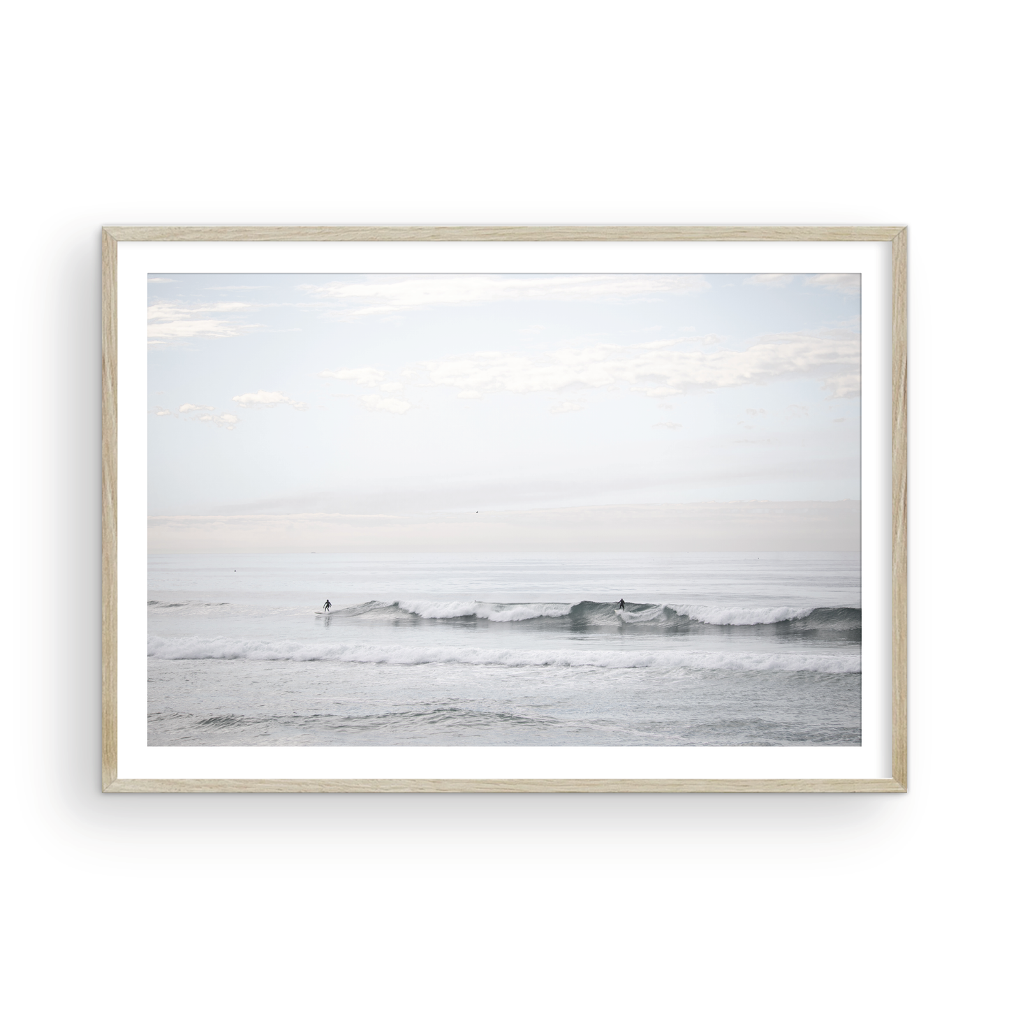 Horizontal minimalist ocean art with a close-up blue waves print of water, featuring subtle ripples and soft textures, ideal as a neutral ocean print, surfers in the waves. Photograph in minimalist mock up.