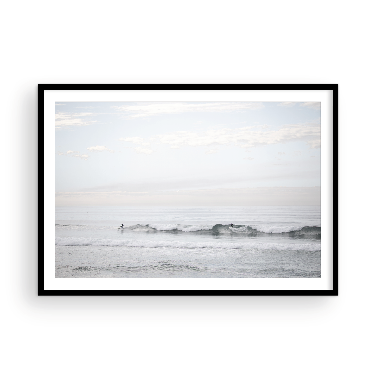 Horizontal minimalist ocean art with a close-up blue waves print of water, featuring subtle ripples and soft textures, ideal as a neutral ocean print, surfers in the waves. Photograph in minimalist mock up.