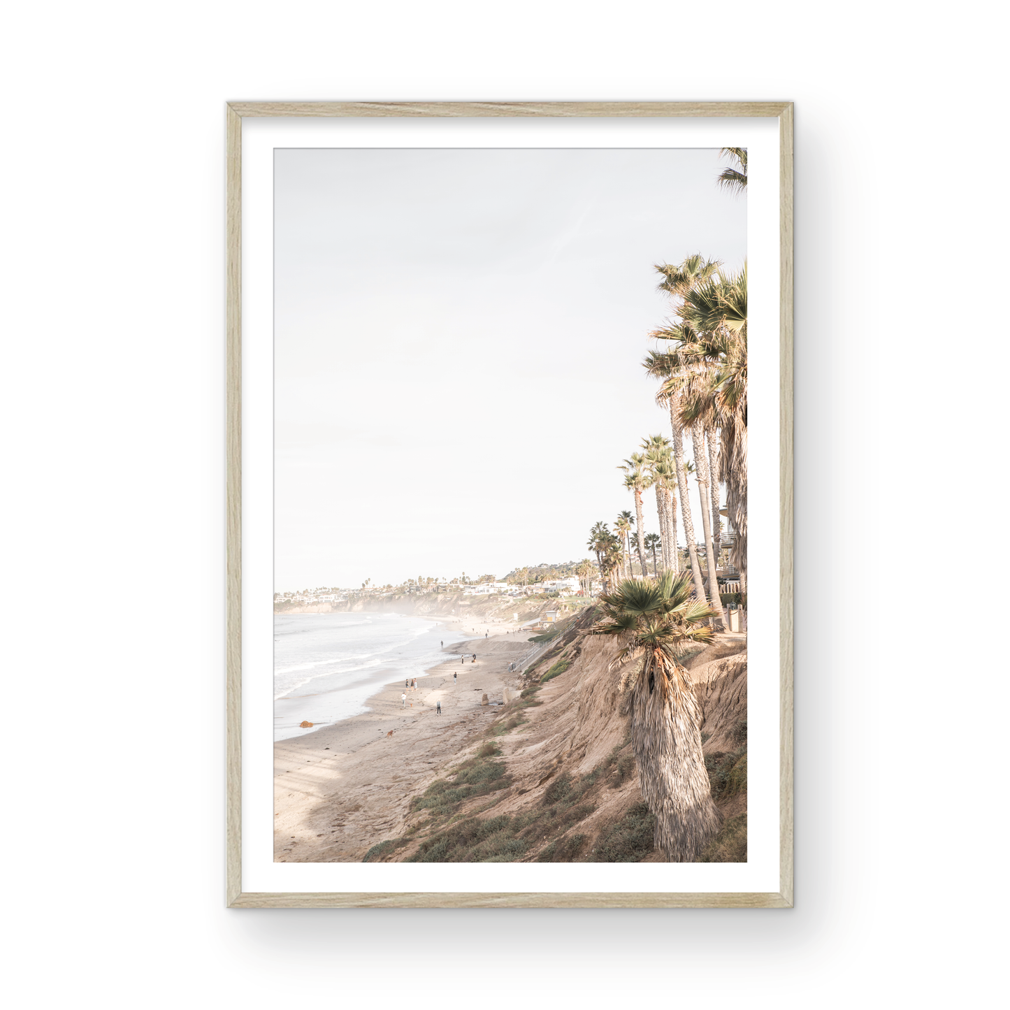 Vertical California coast print featuring a high vantage point overlooking Pacific Beach, with tall palm trees, a sandy beach, and the ocean. This coastal print offers a beautiful seascape. Photograph in minimalist mock up.