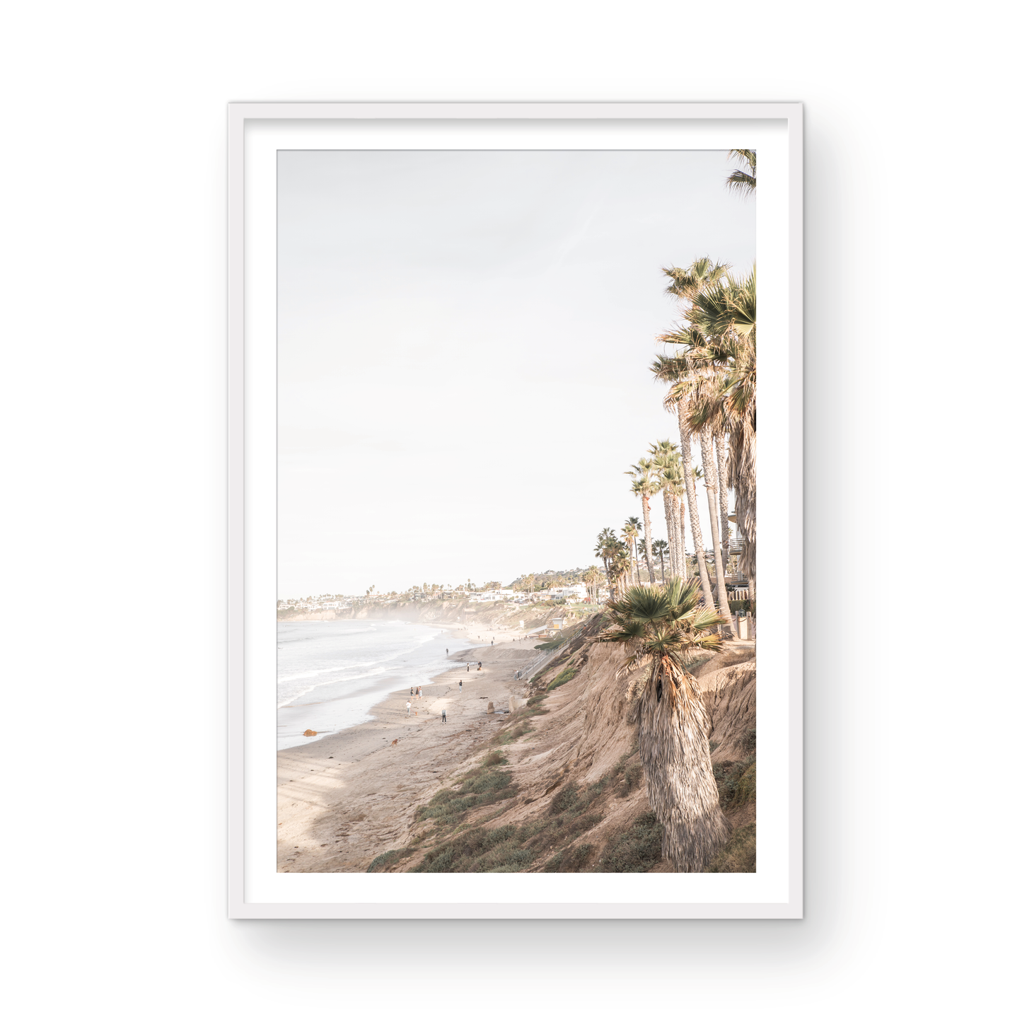 Vertical California coast print featuring a high vantage point overlooking Pacific Beach, with tall palm trees, a sandy beach, and the ocean. This coastal print offers a beautiful seascape. Photograph in minimalist mock up.