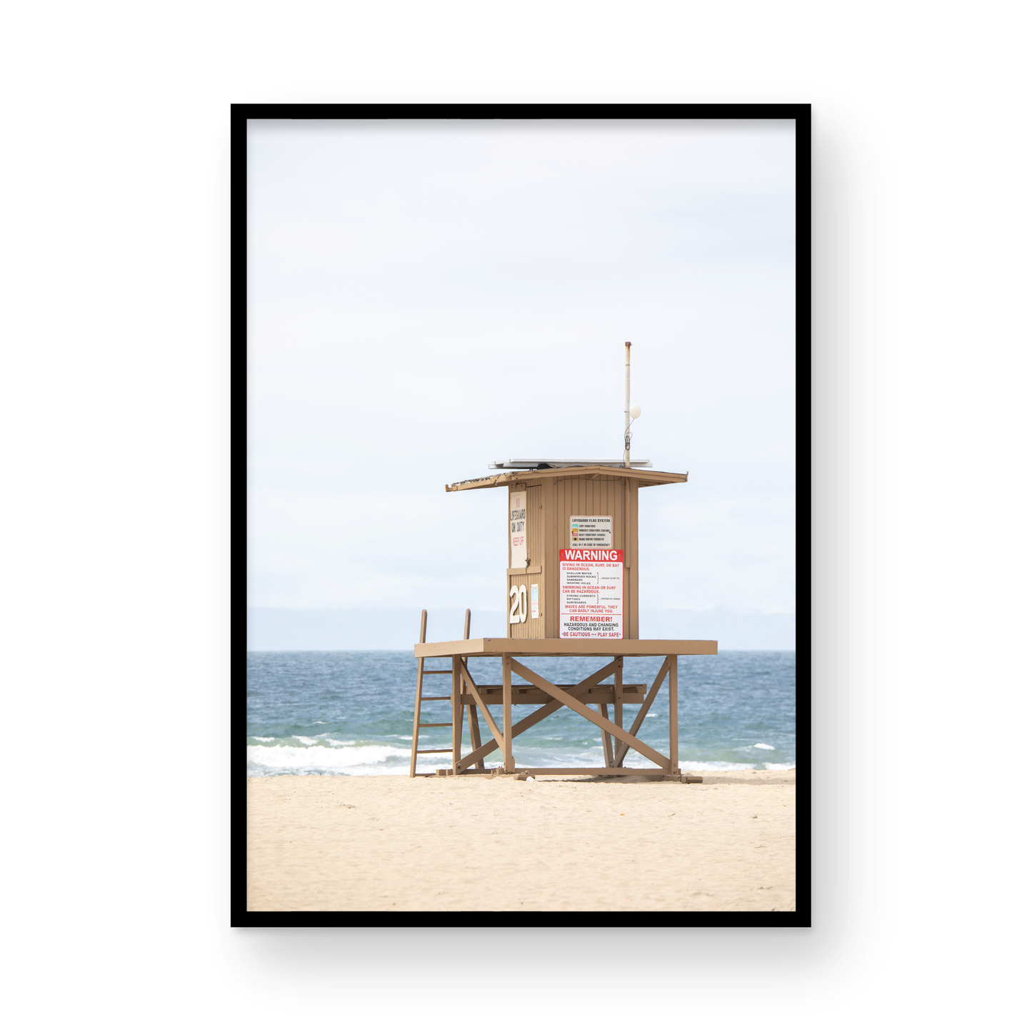 A wide landscape coastal photography view of Newport Beach in Southern California, featuring a lifeguard tower and walls on the beach. Photograph in minimalist mock up.
