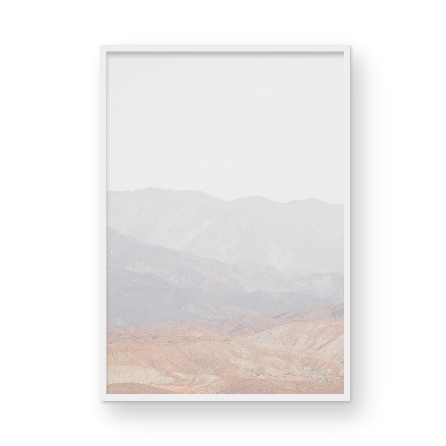 Minimalist art print of hazy mountains layered in soft tones, creating a calm ocean print aesthetic. This vertical minimalist art print can fit a neutral ocean print theme. Photograph in minimalist mock up.