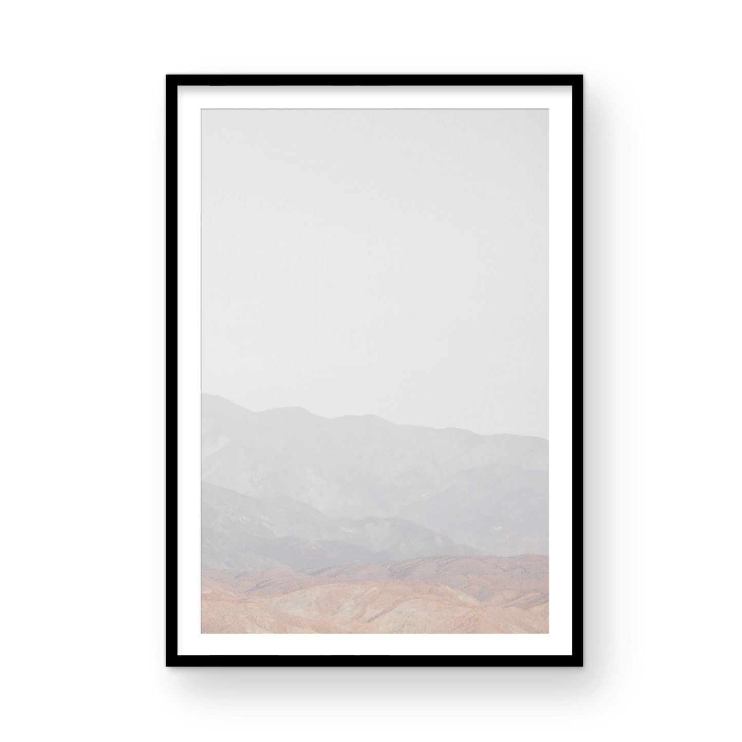 Minimalist art print of hazy mountains layered in soft tones, creating a calm ocean print aesthetic. This vertical minimalist art print can fit a neutral ocean print theme. Photograph in minimalist mock up.