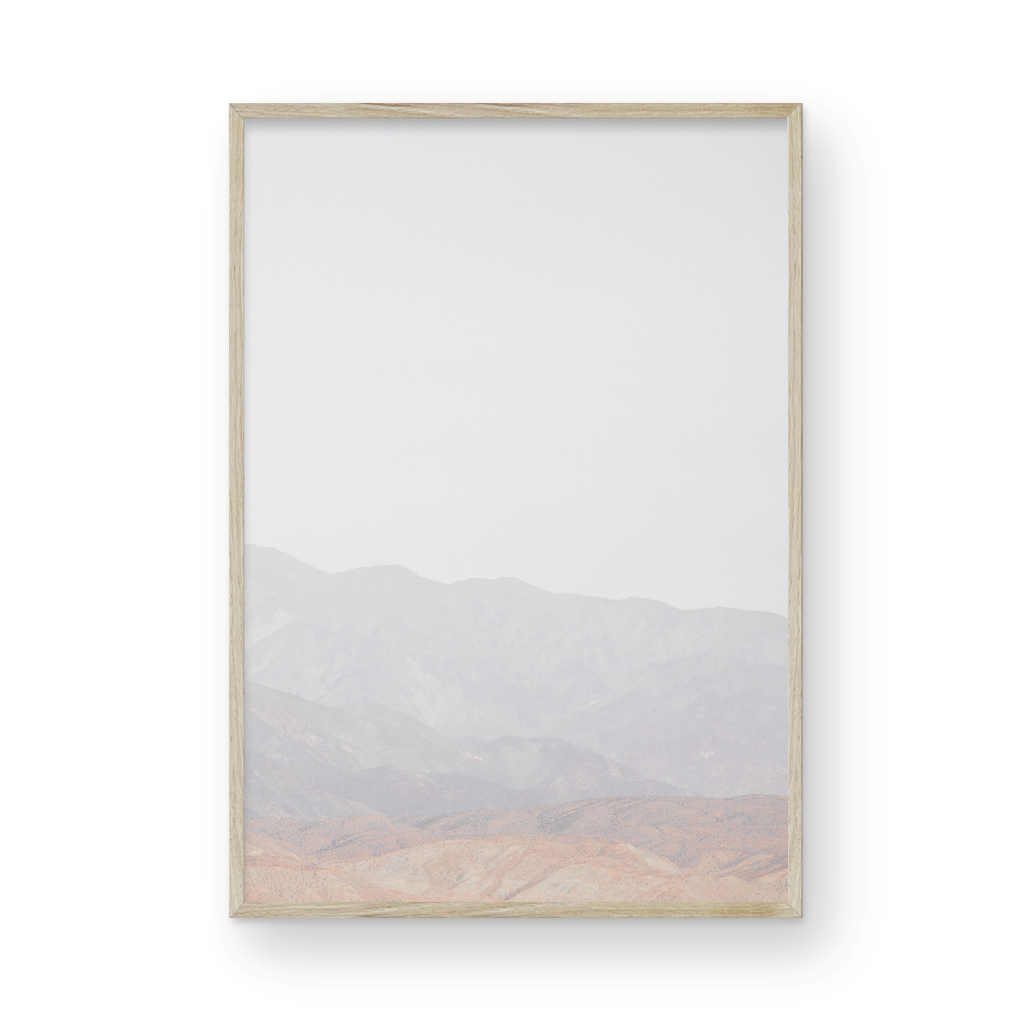 Minimalist art print of hazy mountains layered in soft tones, creating a calm ocean print aesthetic. This vertical minimalist art print can fit a neutral ocean print theme. Photograph in minimalist mock up.