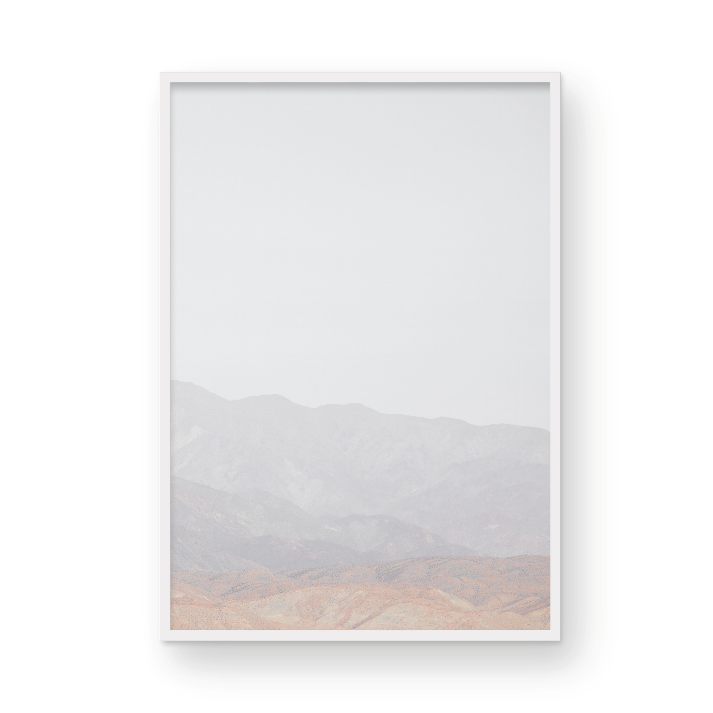 Minimalist art print of hazy mountains layered in soft tones, creating a calm ocean print aesthetic. This vertical minimalist art print can fit a neutral ocean print theme. Photograph in minimalist mock up.