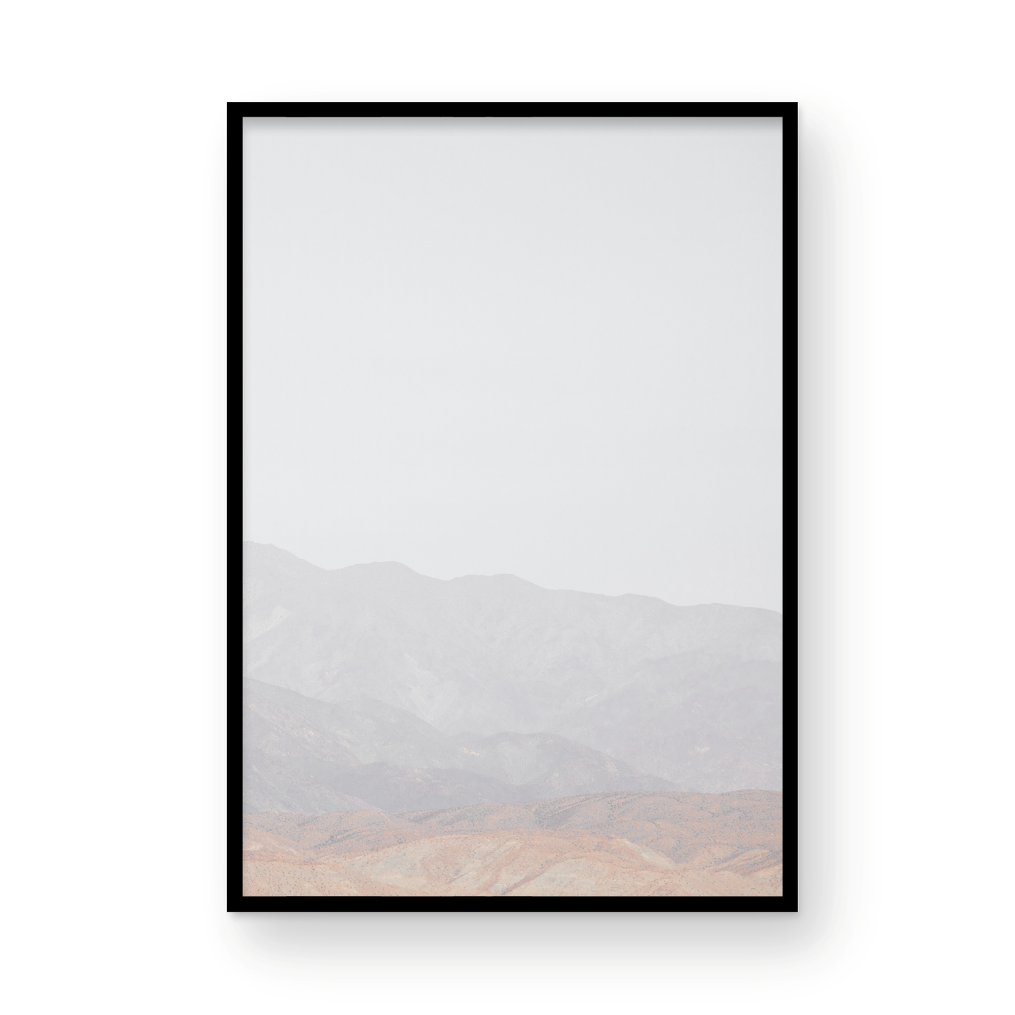 Minimalist art print of hazy mountains layered in soft tones, creating a calm ocean print aesthetic. This vertical minimalist art print can fit a neutral ocean print theme. Photograph in minimalist mock up.