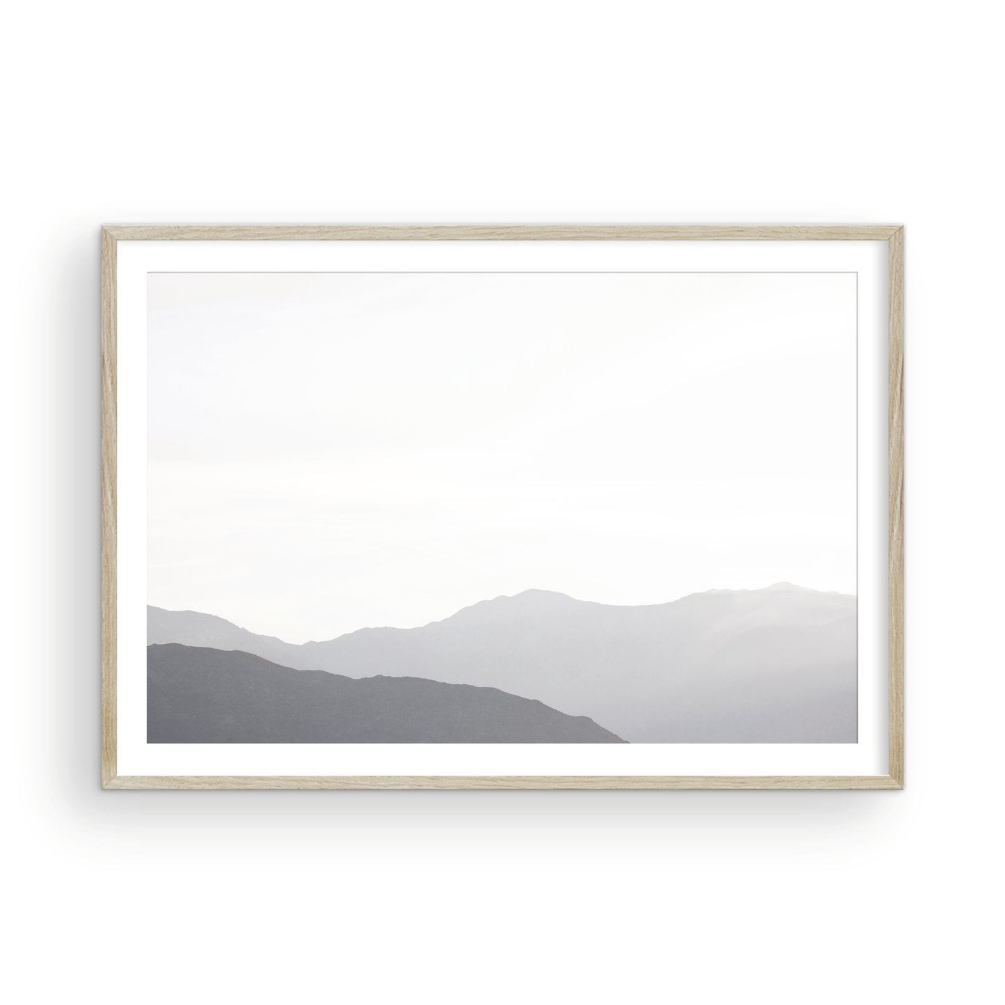 Minimalist horizontal art print of hazy mountains layered in soft tones. Located in Palms Springs, California. Photograph in minimalist mock up