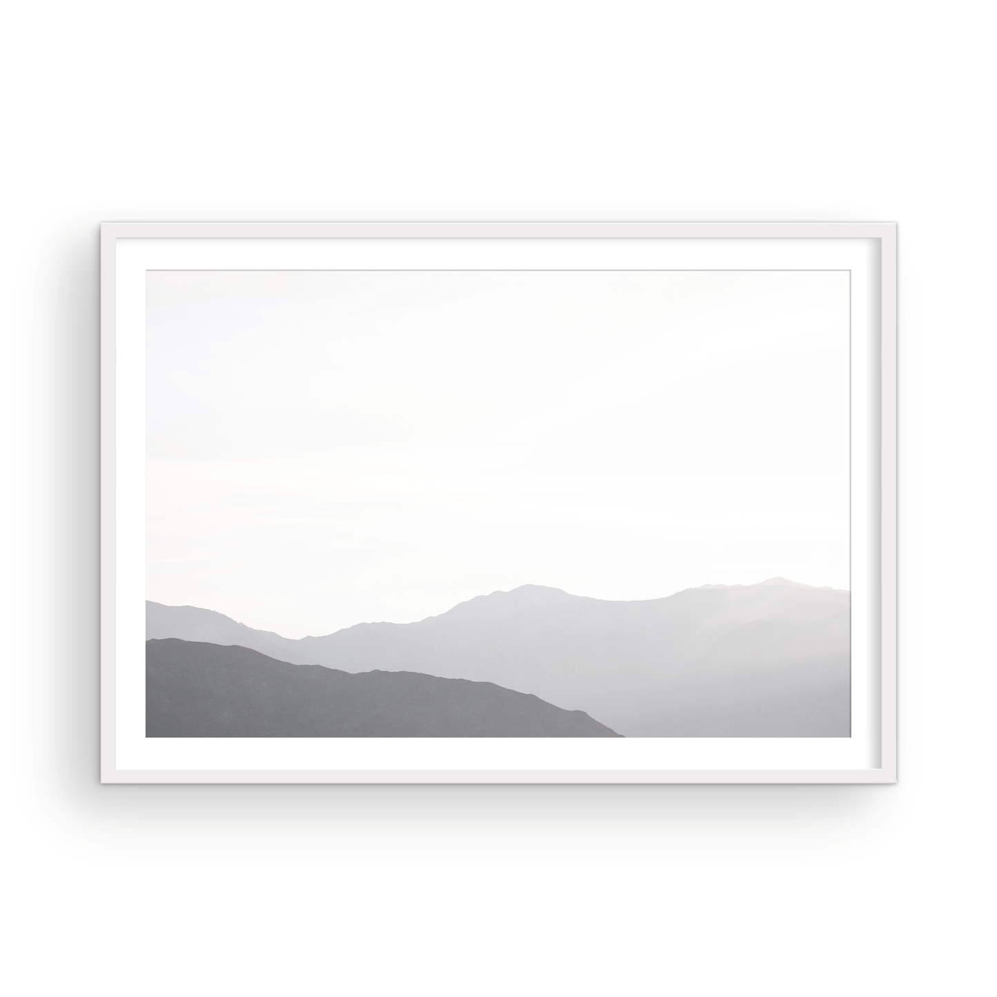 Minimalist horizontal art print of hazy mountains layered in soft tones. Located in Palms Springs, California. Photograph in minimalist mock up