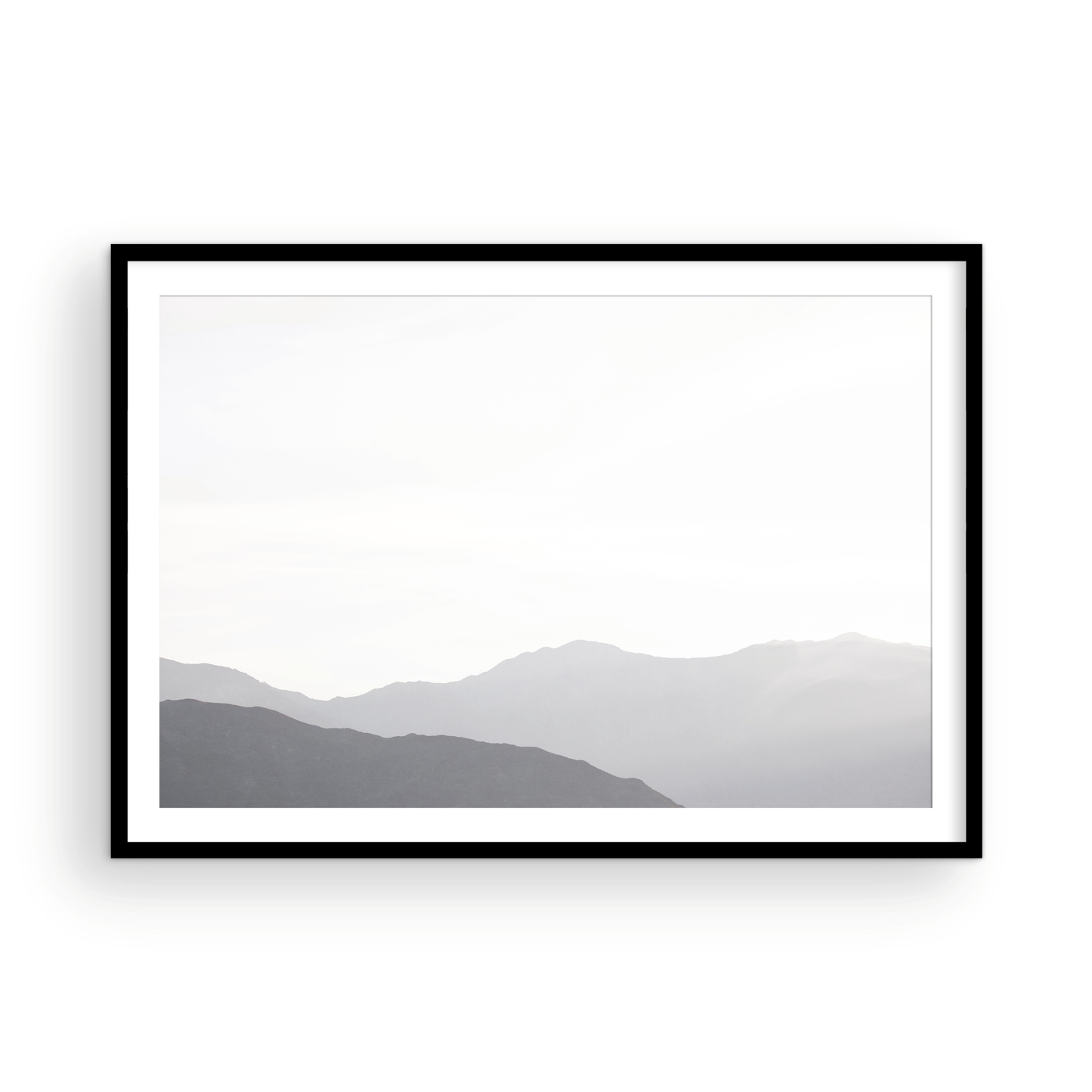 Minimalist horizontal art print of hazy mountains layered in soft tones. Located in Palms Springs, California. Photograph in minimalist mock up