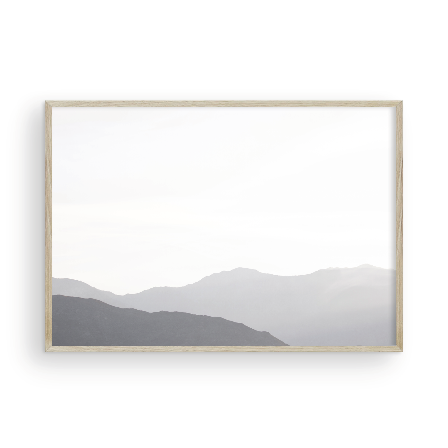 Minimalist horizontal art print of hazy mountains layered in soft tones. Located in Palms Springs, California. Photograph in minimalist mock up
