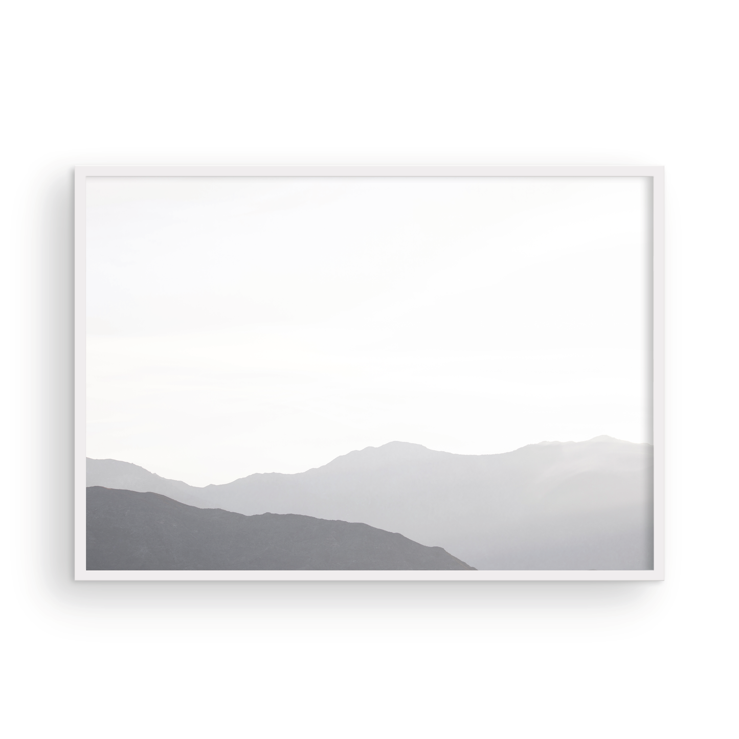 Minimalist horizontal art print of hazy mountains layered in soft tones. Located in Palms Springs, California. Photograph in minimalist mock up
