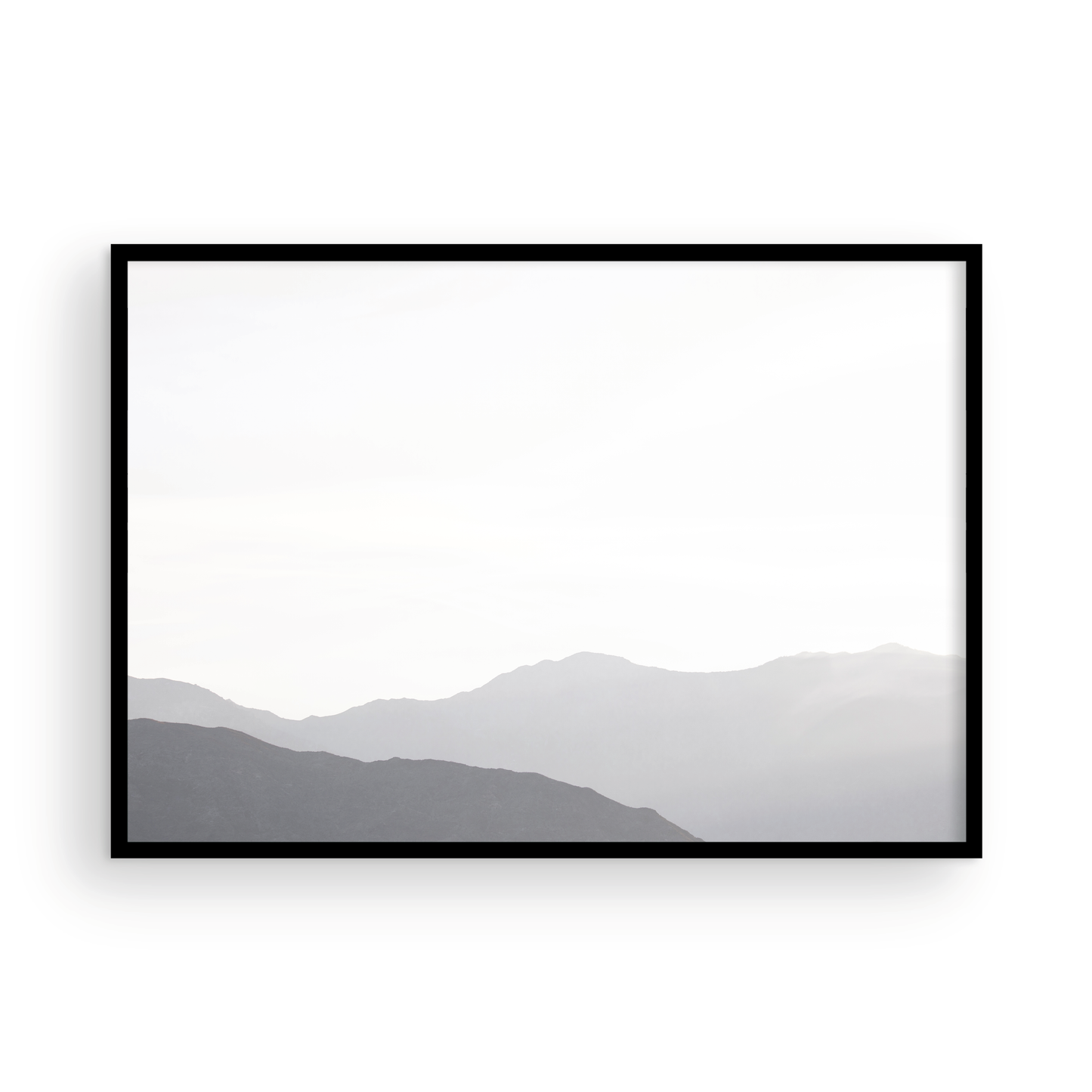 Minimalist horizontal art print of hazy mountains layered in soft tones. Located in Palms Springs, California. Photograph in minimalist mock up