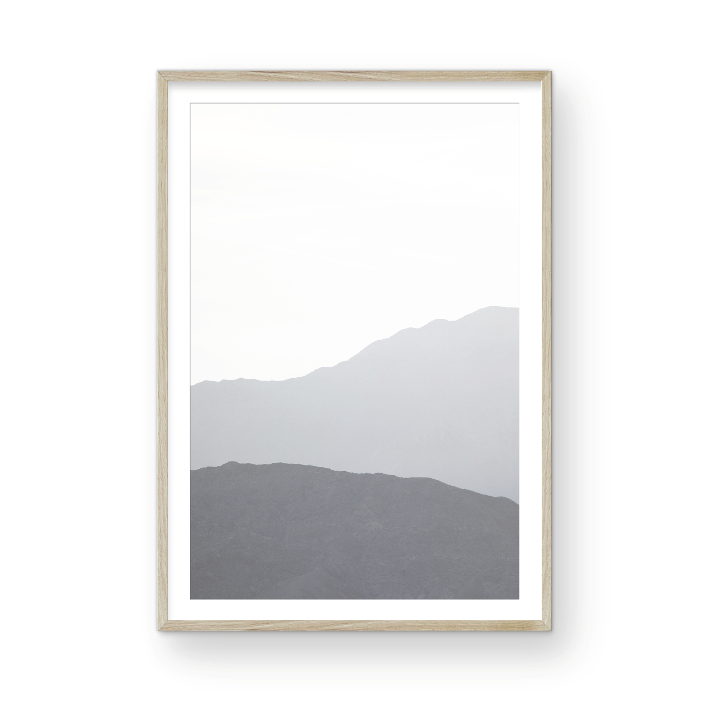 Minimalist vertical art print of hazy mountains layered in soft tones. Located in Palms Springs, California. Photograph in minimalist mock up