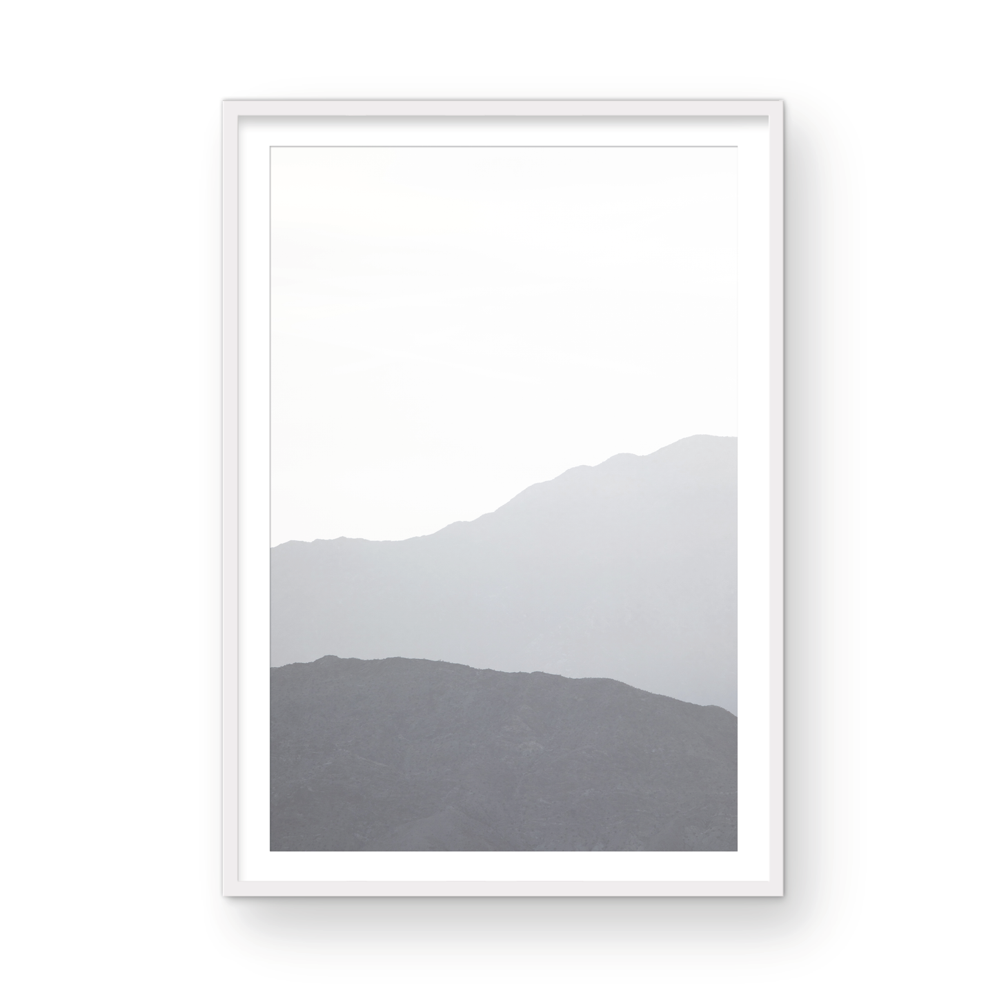 Minimalist vertical art print of hazy mountains layered in soft tones. Located in Palms Springs, California. Photograph in minimalist mock up