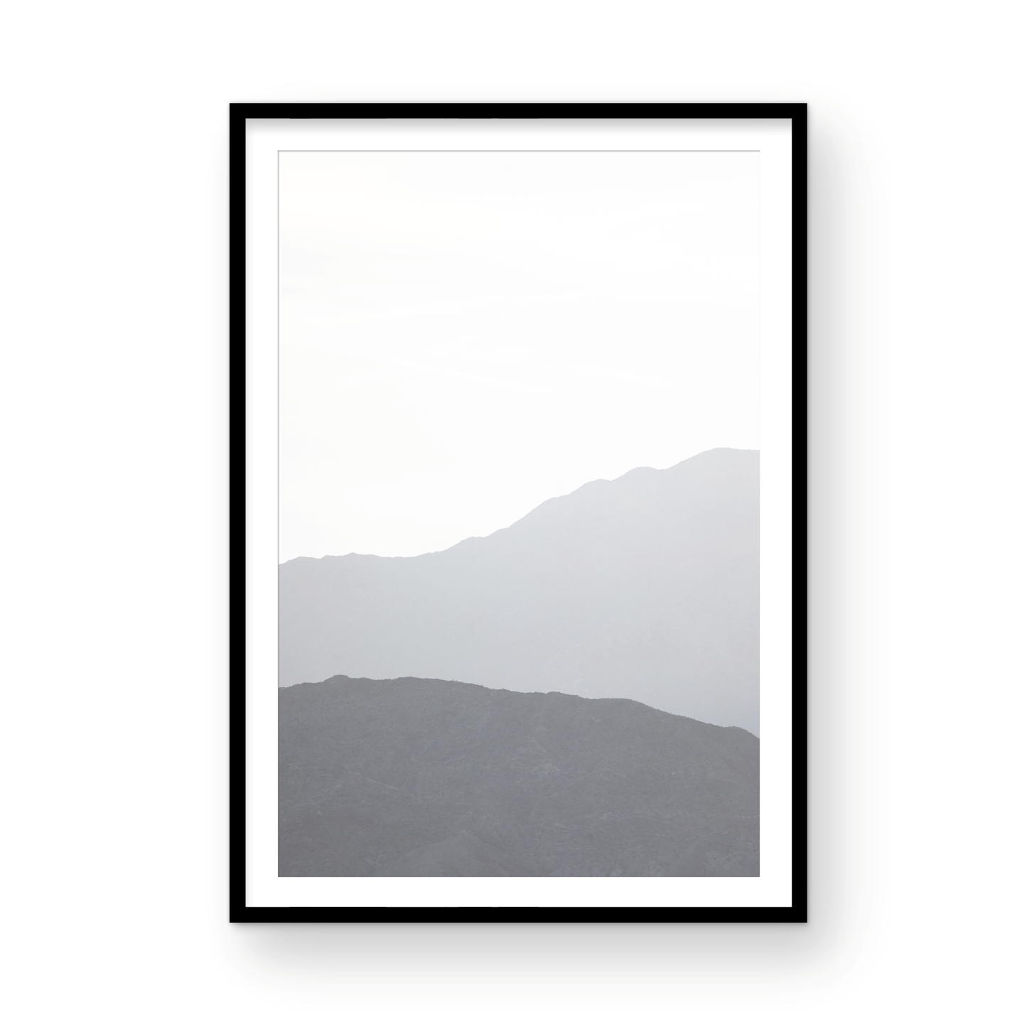 Minimalist vertical art print of hazy mountains layered in soft tones. Located in Palms Springs, California. Photograph in minimalist mock up