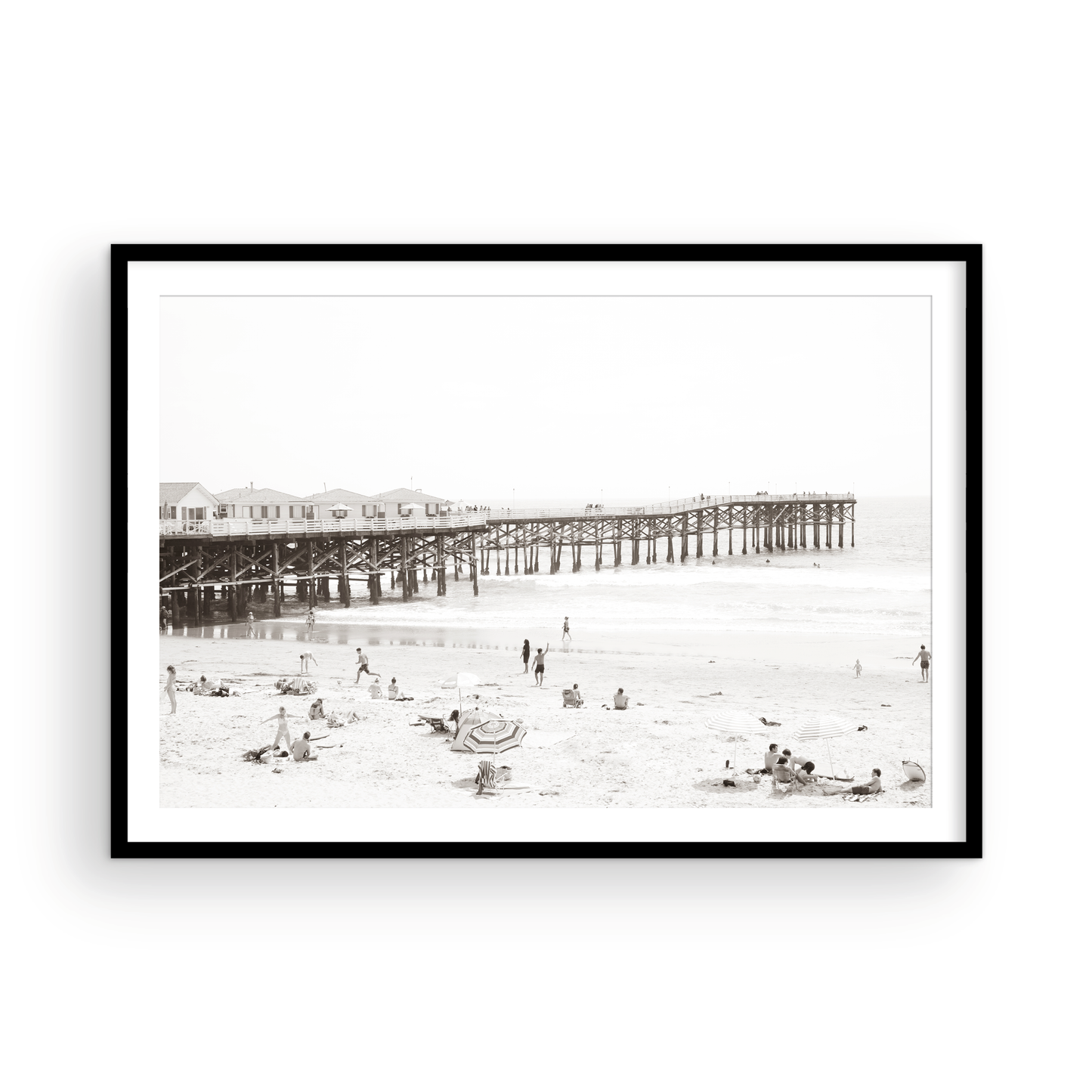 Sepia beach photo of Crystal Pier in Pacific Beach, San Diego, with people on the sandy beach. This framed coastal print showcases iconic beach scenes. Photograph in minimalist mock up.