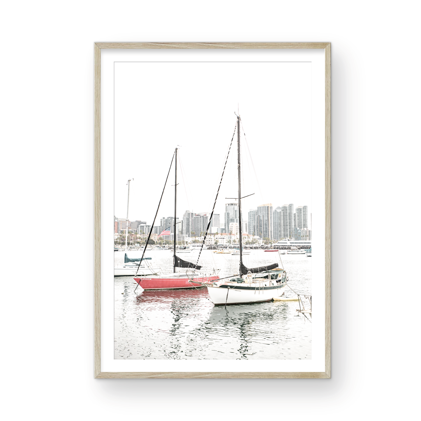 A vertical San Diego print showcasing numerous sailboats in San Diego Harbor with the city skyline in the background. This modern coastal print embodies the Southern California coastal photography, perfect for a large beach wall art. Photograph in minimalist mock up.