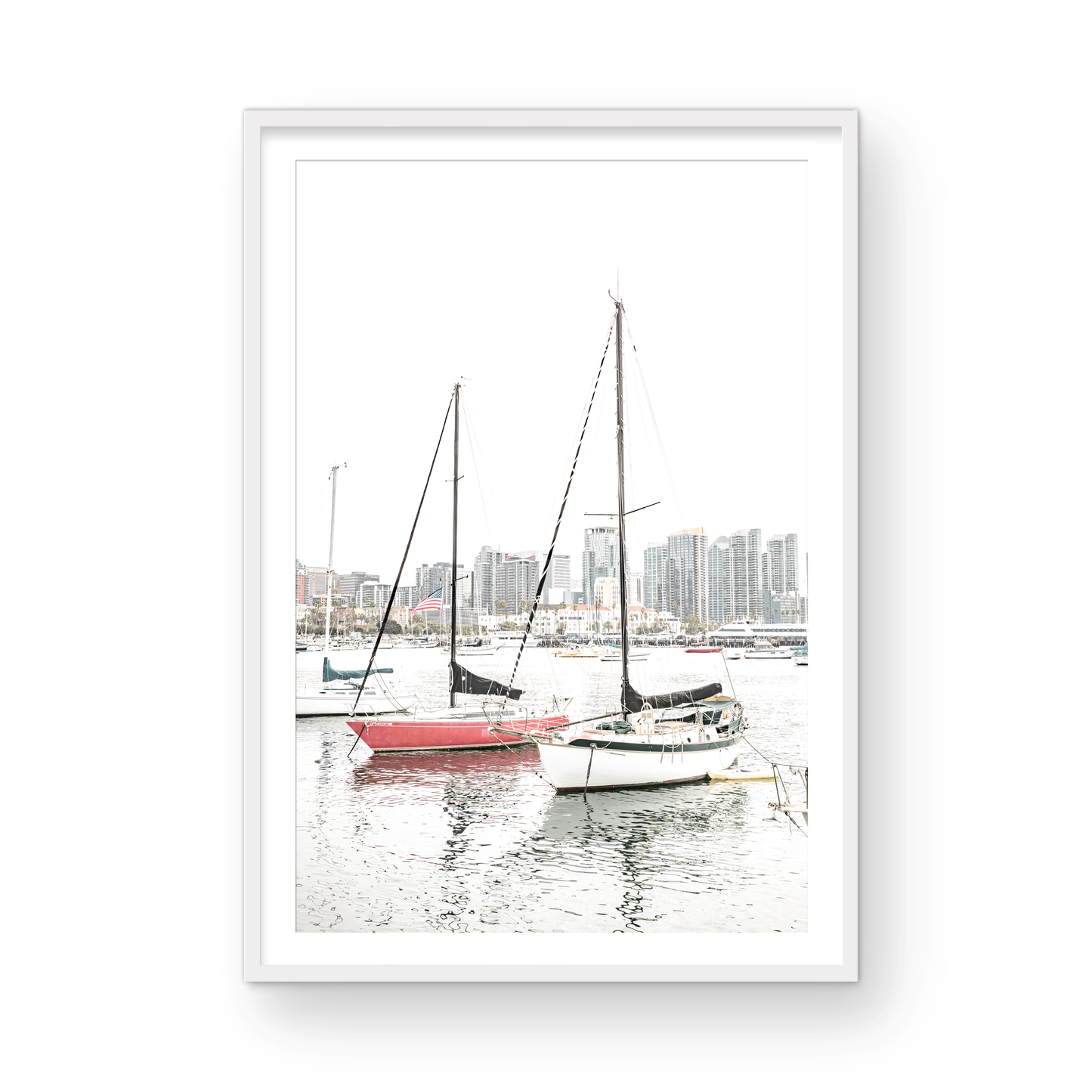 A vertical San Diego print showcasing numerous sailboats in San Diego Harbor with the city skyline in the background. This modern coastal print embodies the Southern California coastal photography, perfect for a large beach wall art. Photograph in minimalist mock up.