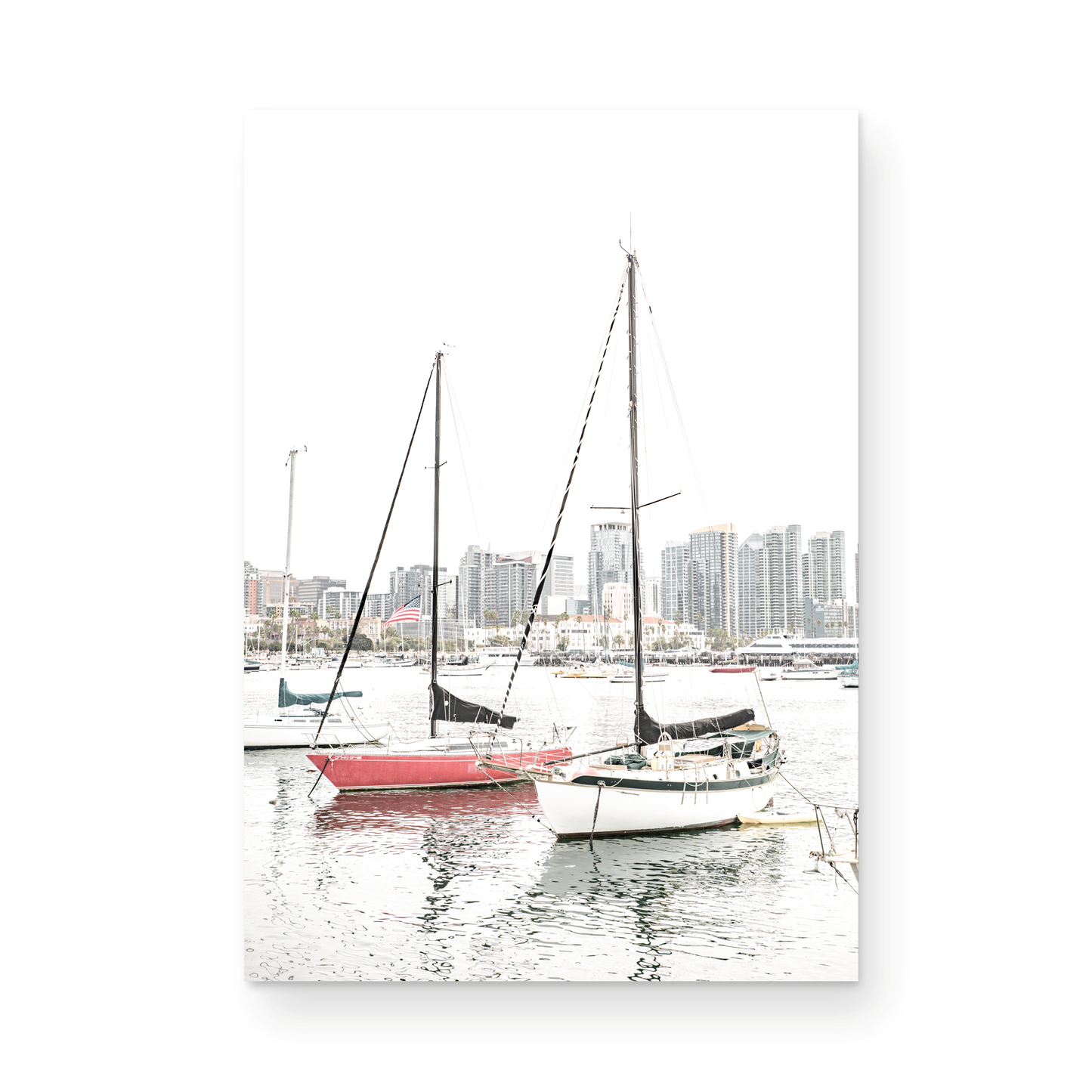 A vertical San Diego print showcasing numerous sailboats in San Diego Harbor with the city skyline in the background. This modern coastal print embodies the Southern California coastal photography, perfect for a large beach wall art. Photograph in minimalist mock up.