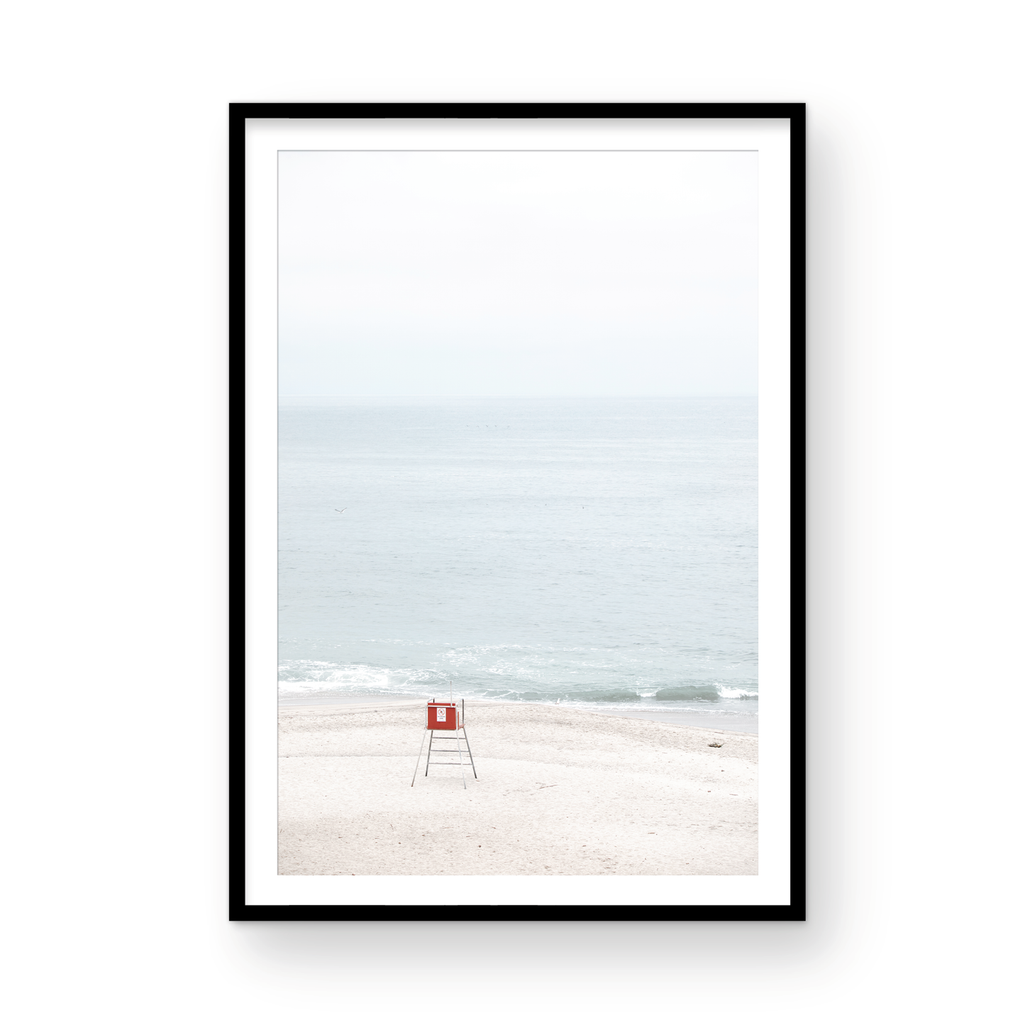 Vertical coastal photography featuring a red and white lifeguard chair and a calm ocean background, located in Laguna California. Photograph in minimalist mock up.