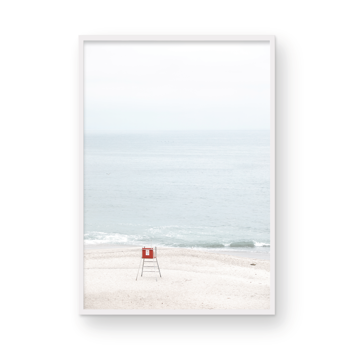 Vertical coastal photography featuring a red and white lifeguard chair and a calm ocean background, located in Laguna California. Photograph in minimalist mock up.