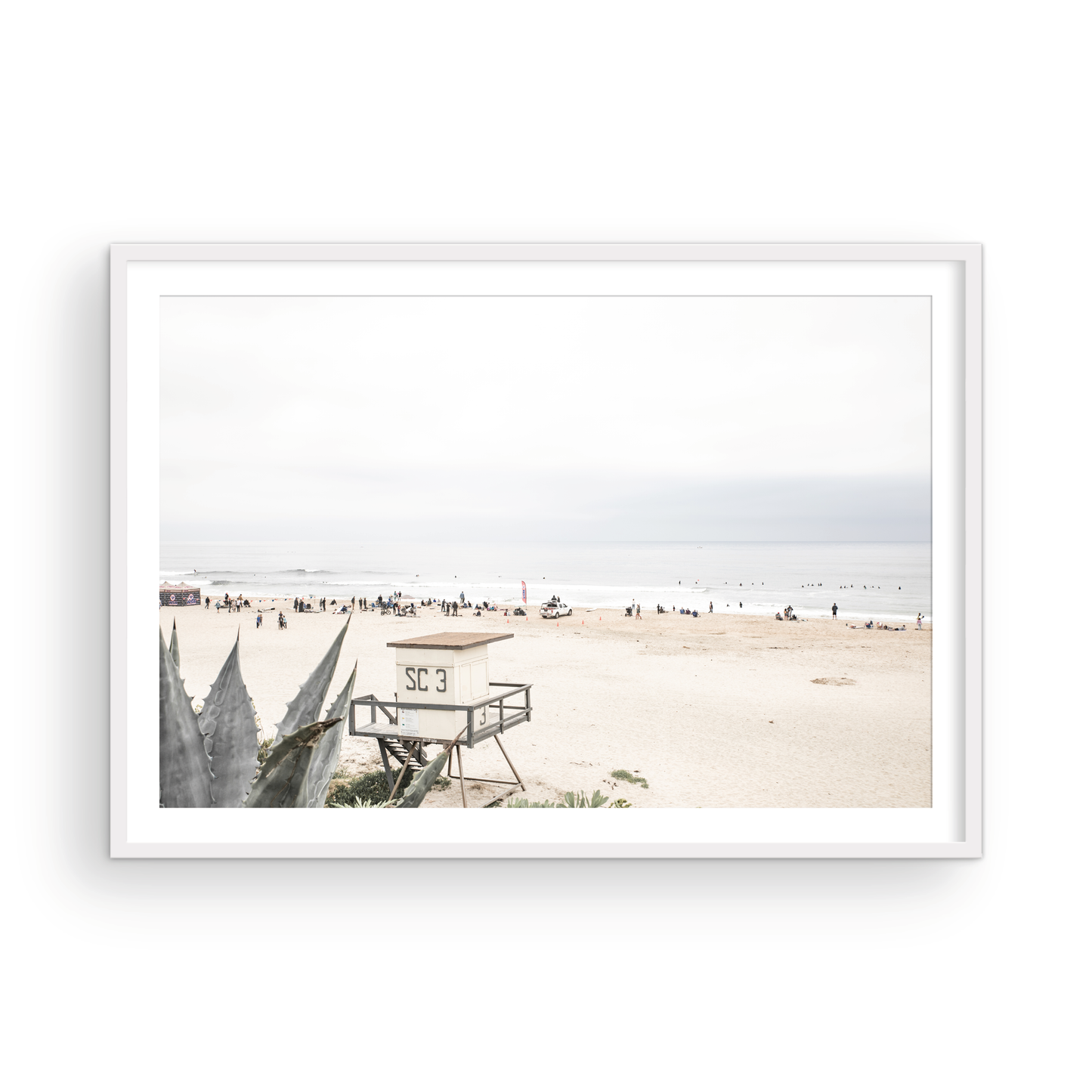 Landscape beach photography of Salt Creek Beach, with lifeguard tower SC 3 in the foreground, and many people enjoying the beach and ocean in the distance. A beach vibes print. Photograph in minimalist mock up.