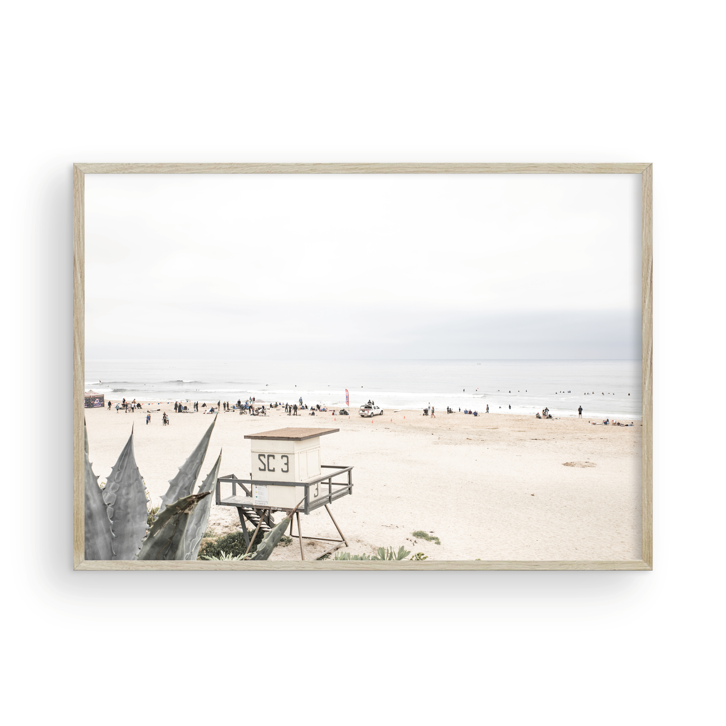Landscape beach photography of Salt Creek Beach, with lifeguard tower SC 3 in the foreground, and many people enjoying the beach and ocean in the distance. A beach vibes print. Photograph in minimalist mock up.