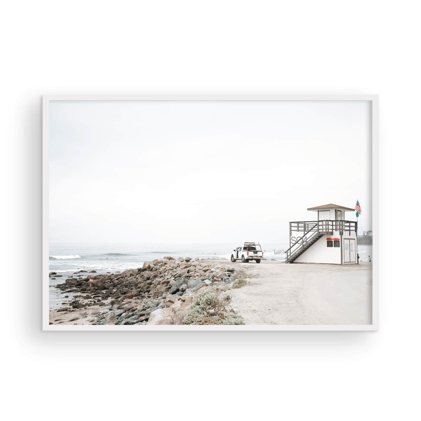 Landscape beach photography of Salt Creek Beach, with lifeguard tower SC 4 in the foreground, and many people enjoying the beach and ocean in the distance. A beach vibes print. Photograph in minimalist mock up.