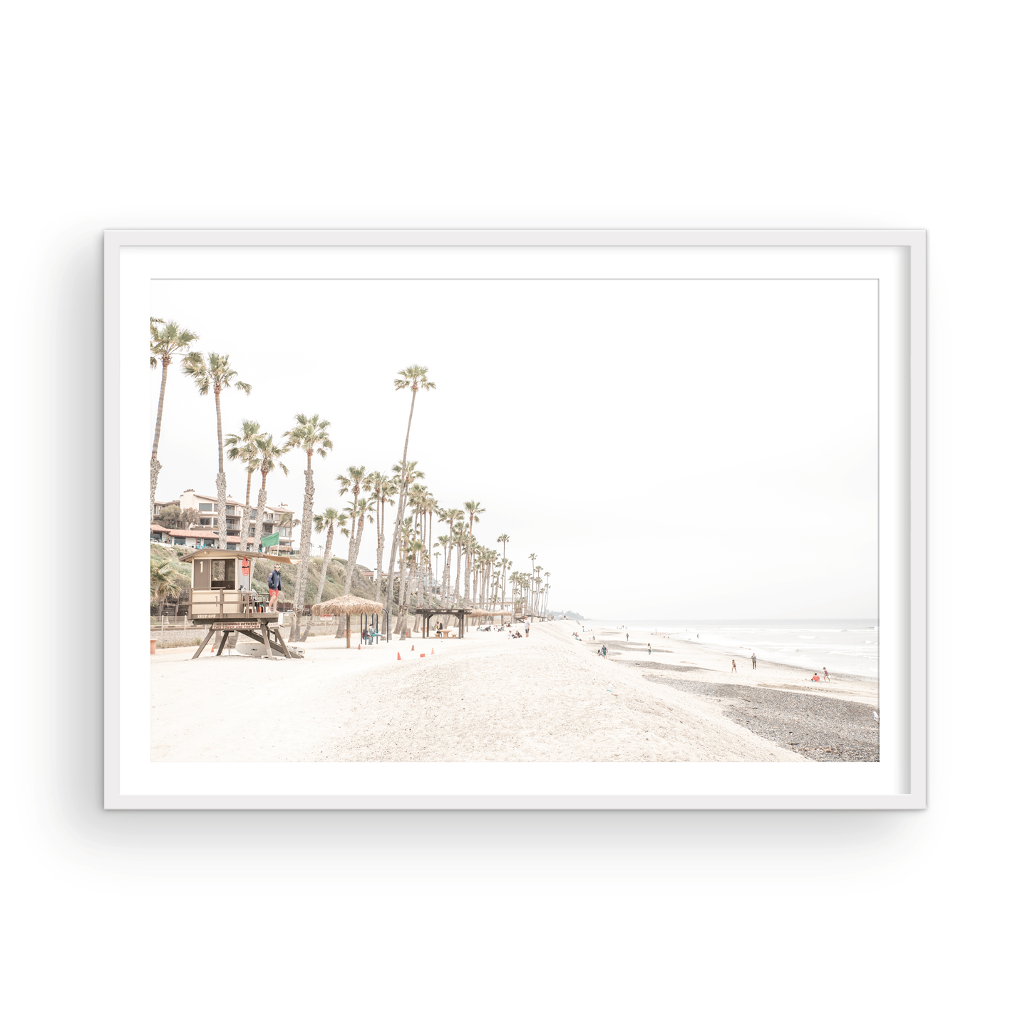A wide landscape coastal photography view of San Clemente State Beach in Southern California, featuring a row of tall palm trees, a lifeguard tower, and people enjoying the calm beach. This horizontal image evokes Summer Vibes Wall Art and tropical beach print aesthetics. Photograph in minimalist mock up.