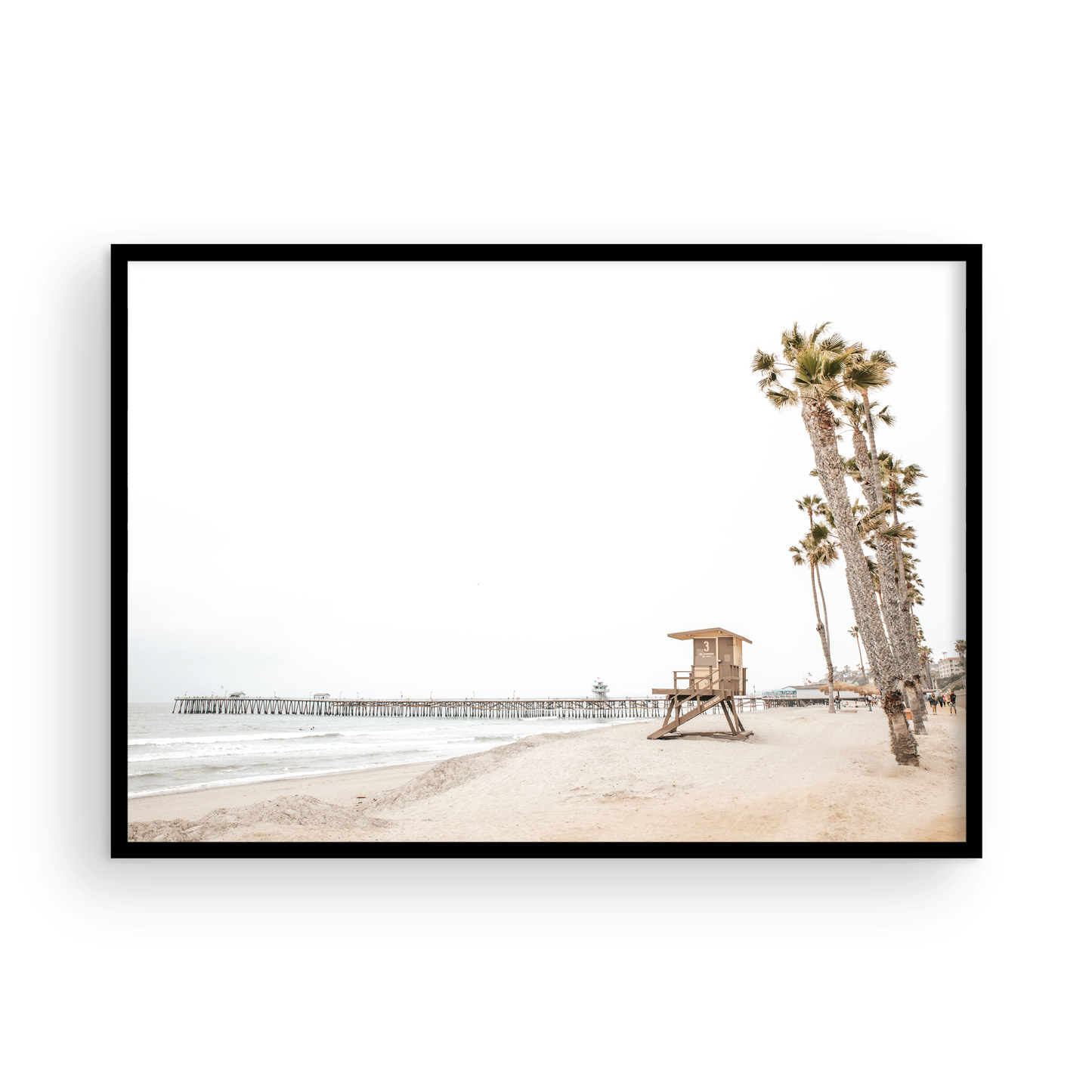 A wide landscape coastal photography view of San Clemente State Beach in Southern California, featuring a row of tall palm trees, a lifeguard tower, and people enjoying the calm beach. This image evokes Summer Vibes Wall Art and tropical beach print aesthetics. Photograph in minimalist mock up.