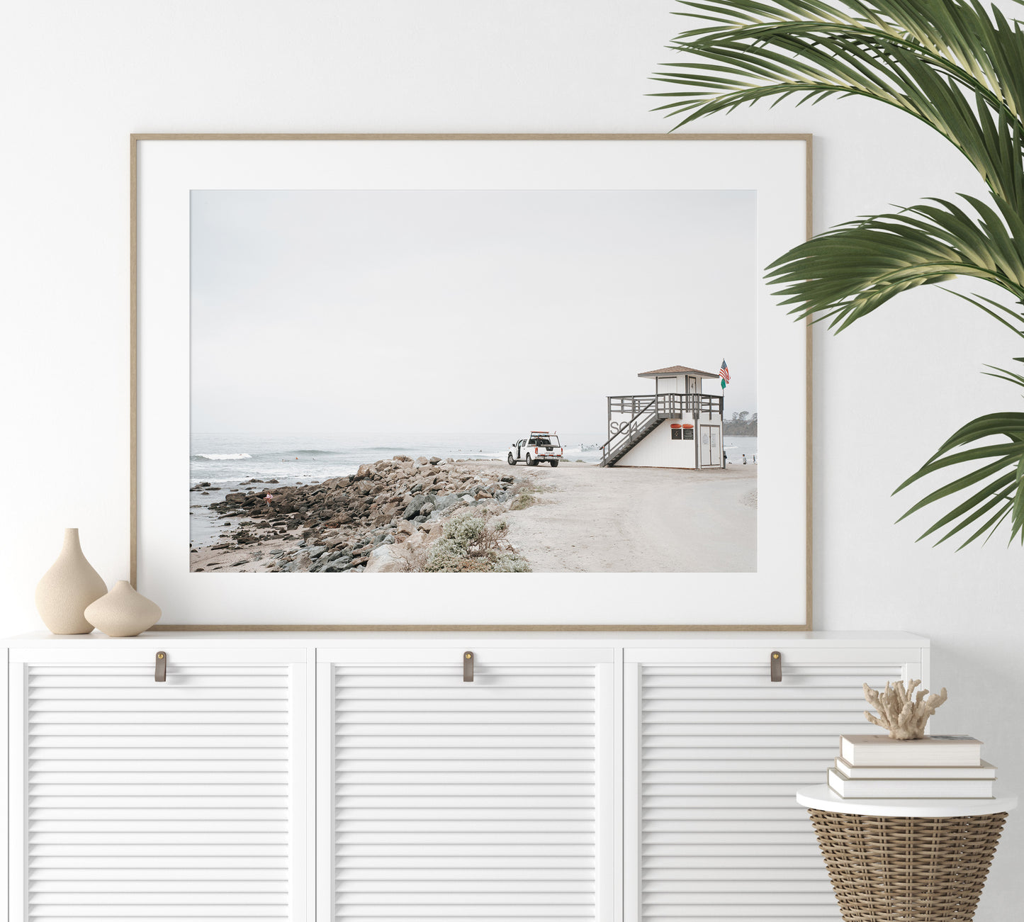 Landscape beach photography of Salt Creek Beach, with lifeguard tower SC 4 in the foreground, and many people enjoying the beach and ocean in the distance. A beach vibes print. Photograph in minimalist mock up.