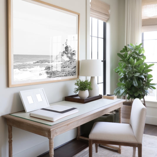 Fine art of WindanSea Beach, La Jolla California horizontal landscape black and white print by Southern California photographer Kim Dybczak of Salt Creek Prints, featuring a powerful waves crashing against the rocky shore of California coast. Beach homes and palm trees sit atop the cliffside, with stairs leading down to a sheltered area. Photograph in minimalist mock up