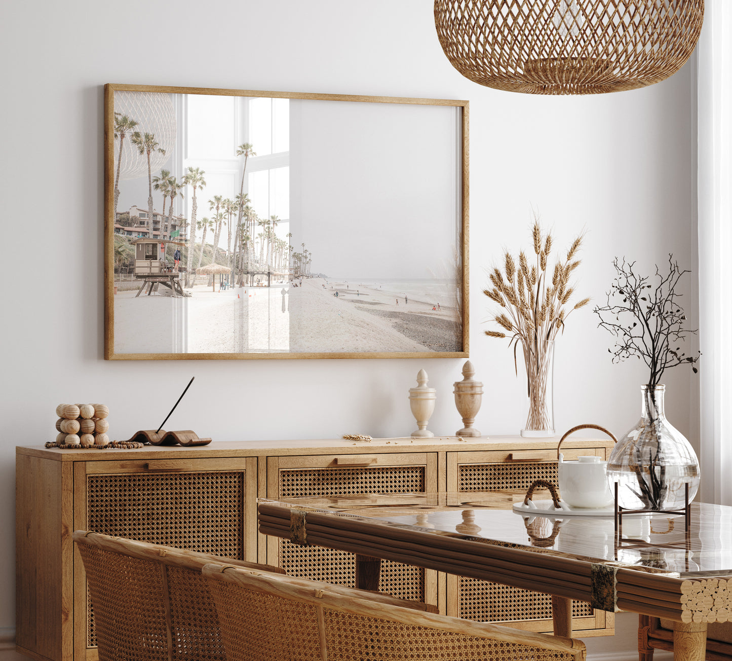 A wide landscape coastal photography view of San Clemente State Beach in Southern California, featuring a row of tall palm trees, a lifeguard tower, and people enjoying the calm beach. This horizontal image evokes Summer Vibes Wall Art and tropical beach print aesthetics. Photograph in minimalist mock up.