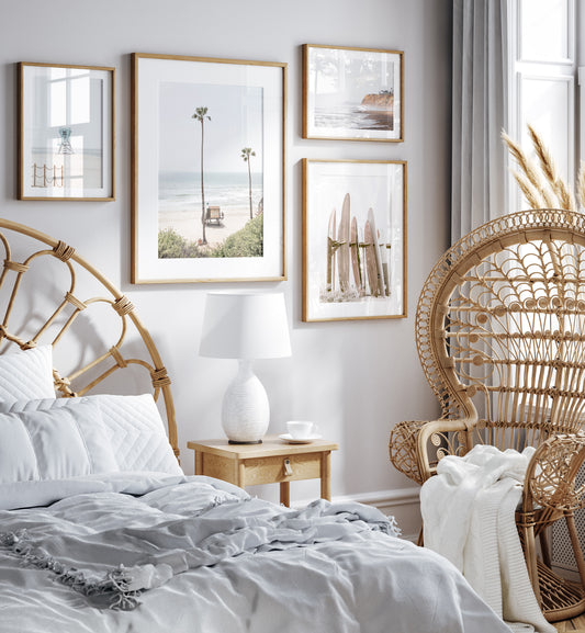 Vertical beach wall art featuring a lifeguard tower nestled between two tall palm trees on a sunny California beach, capturing a serene beach vibe. Photograph in minimalist mock up.