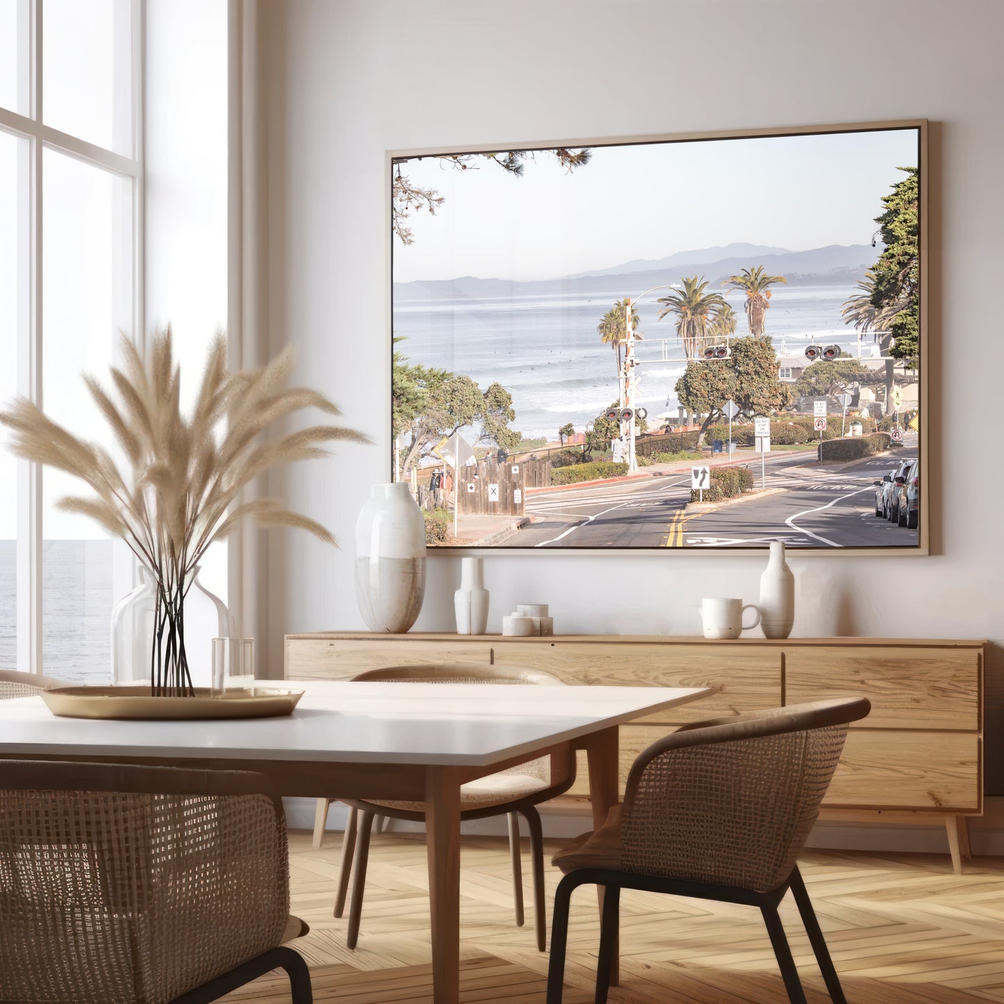 Coastal fine art photography print featuring a scenic view of a coastal road with palm trees, ocean in the background. Photograph in minimalist mock up.